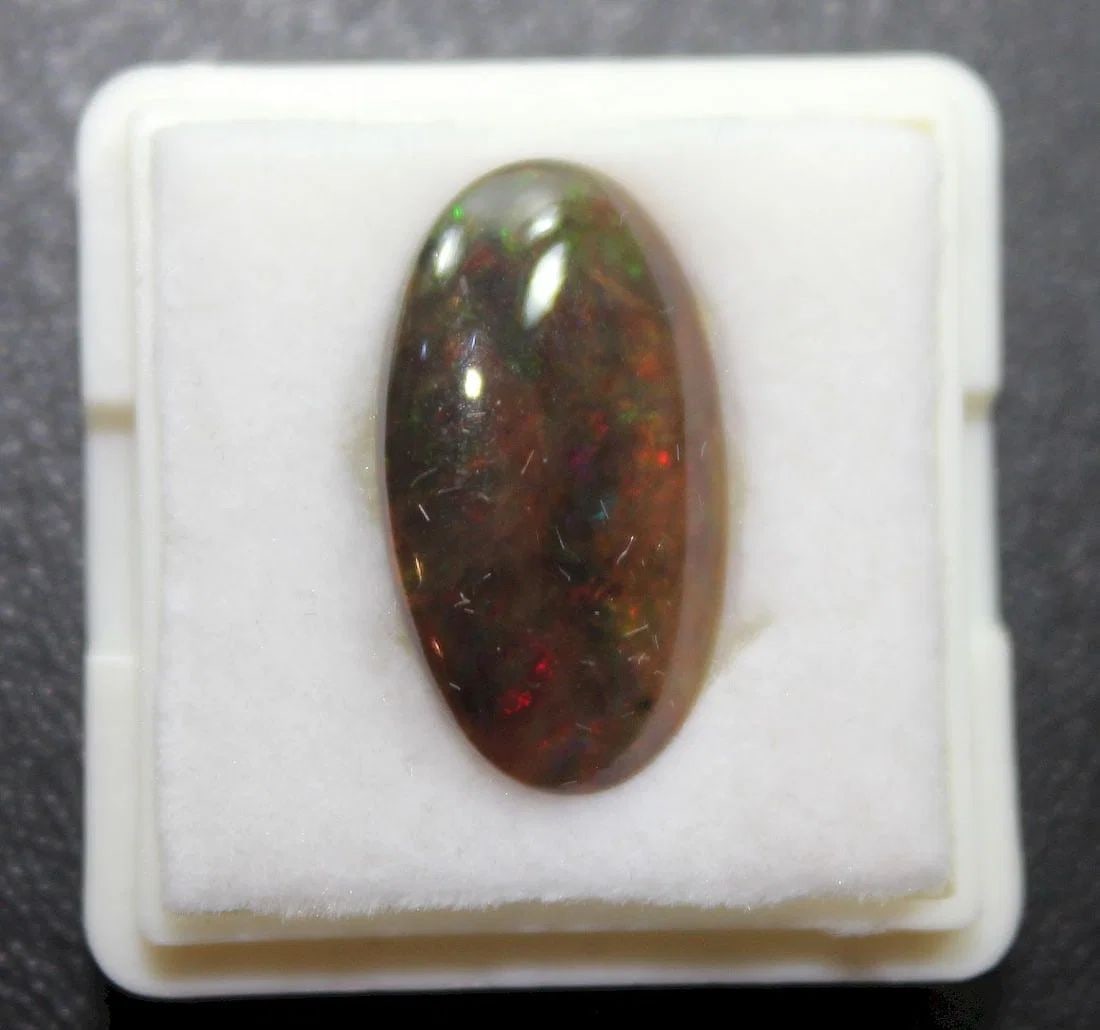AUSTRALIAN OPAQUE SOLID OPAL WITH ELONGATED CABOCHON CUT (1 of 2)