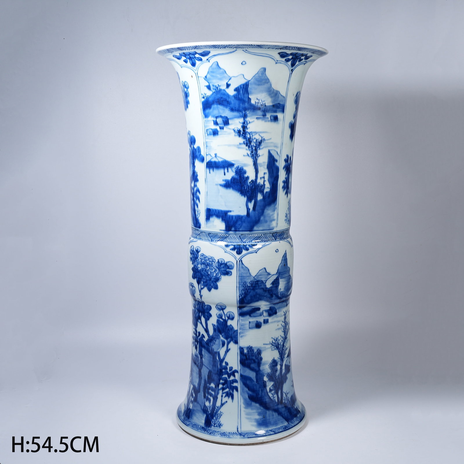 A LARGE BLUE AND WHITE GU VASE WITH LANDSCAPE AND FIGURE MOTIFS: Large Blue and White Gu Vase with Landscape and Figure Motifs
