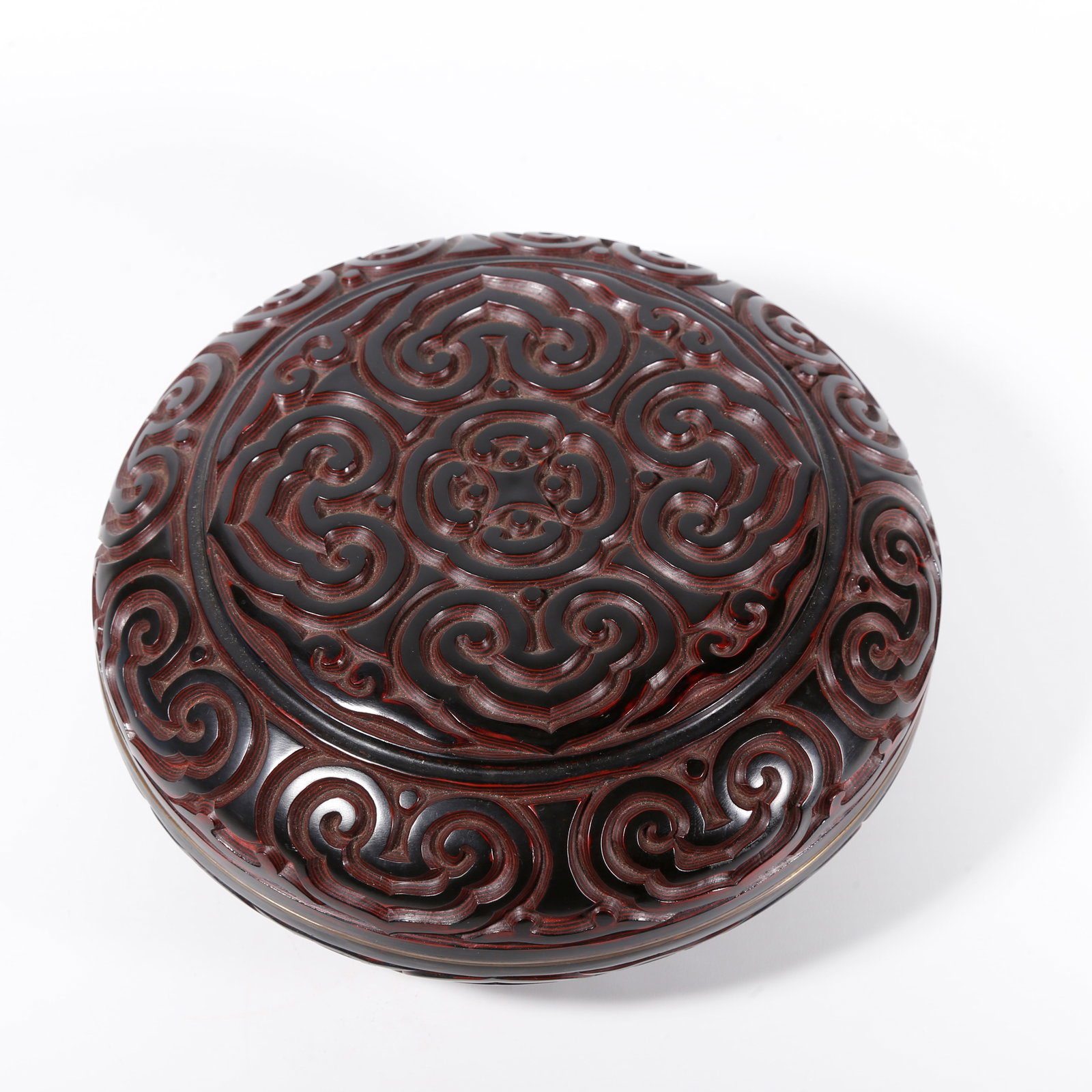 A COVERED BOX OF CARVED BLACK-AND-RED LACQUER WITH FLORAL PATTERNS (1 of 7)
