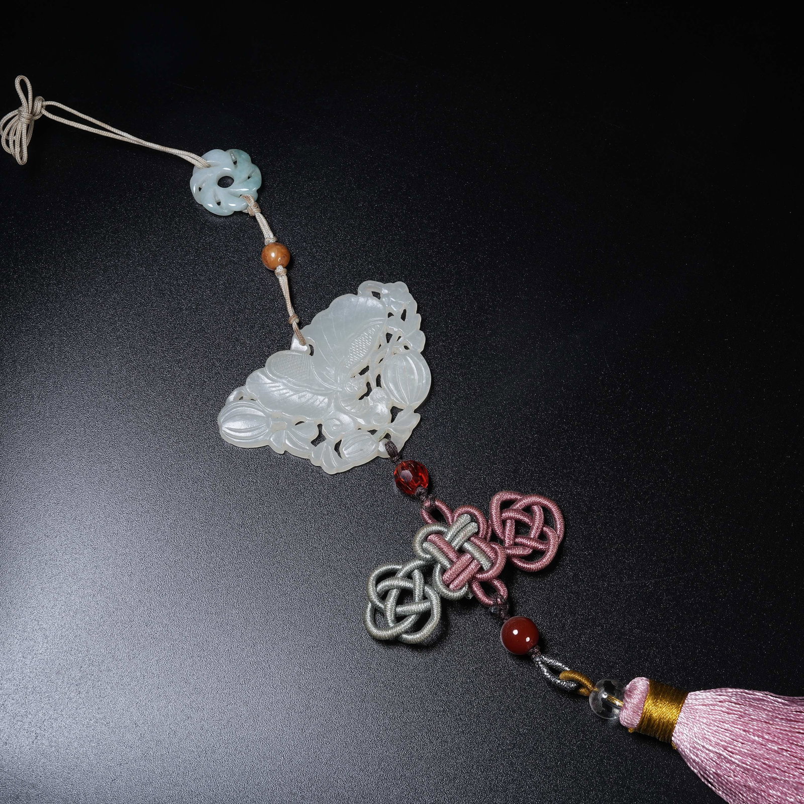 A HETIAN JADE PENDANT CARVED WITH FLOWERS, FRUITS AND MELONS (1 of 9)