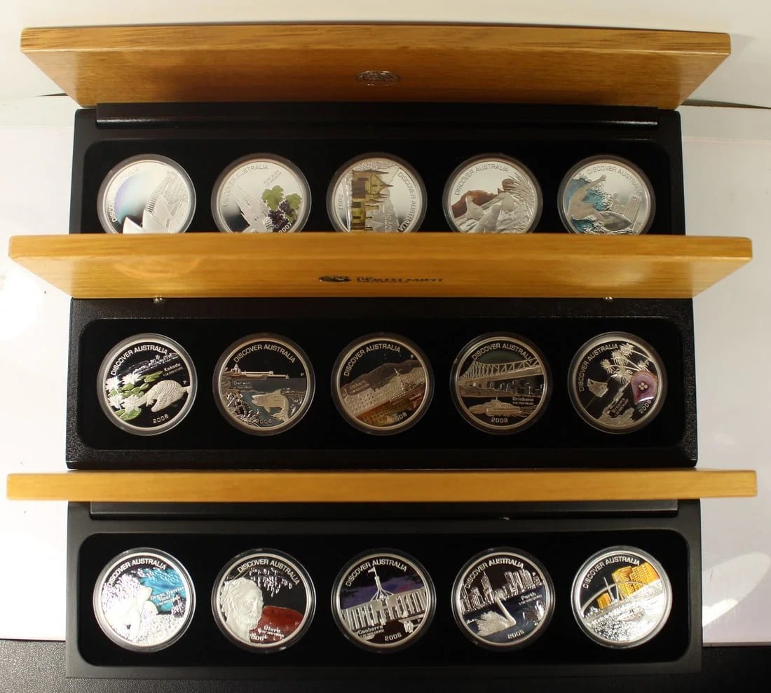AUSTRALIA 2007 'DISCOVER AUSTRALIA' PROOF SILVER (999) COLOURED DOLLARS, FDC (15 COINS): Australia 2007 'Discover Australia' Proof Silver (999) Coloured Dollars, FDC (15 coins)