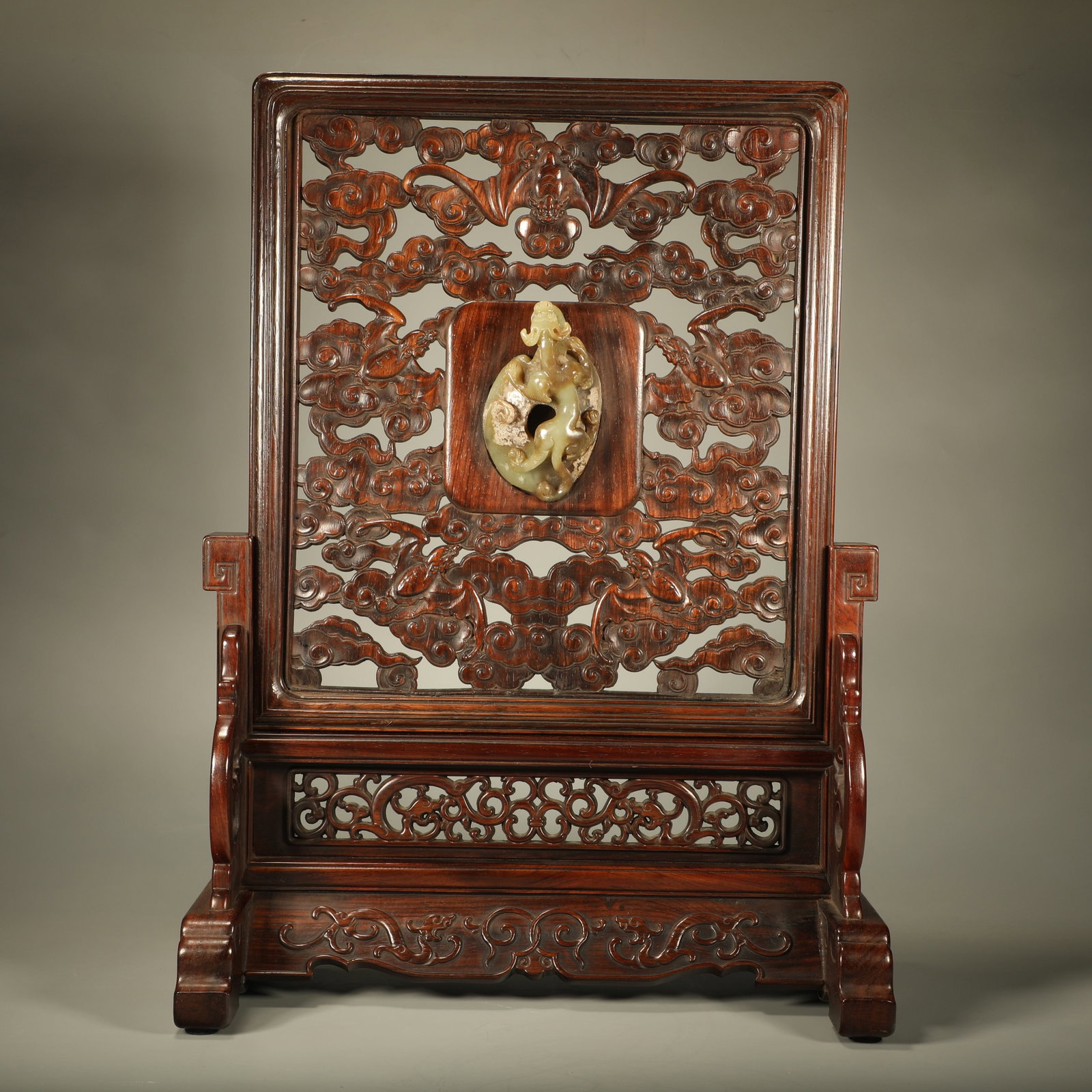 A PADAUK STANDING SCREEN CARVED WITH CLOUD AND BLESSING PATTERNS INLAID WITH JADE: Padauk Standing Screen Carved with Cloud and Blessing Patterns Inlaid with Jade