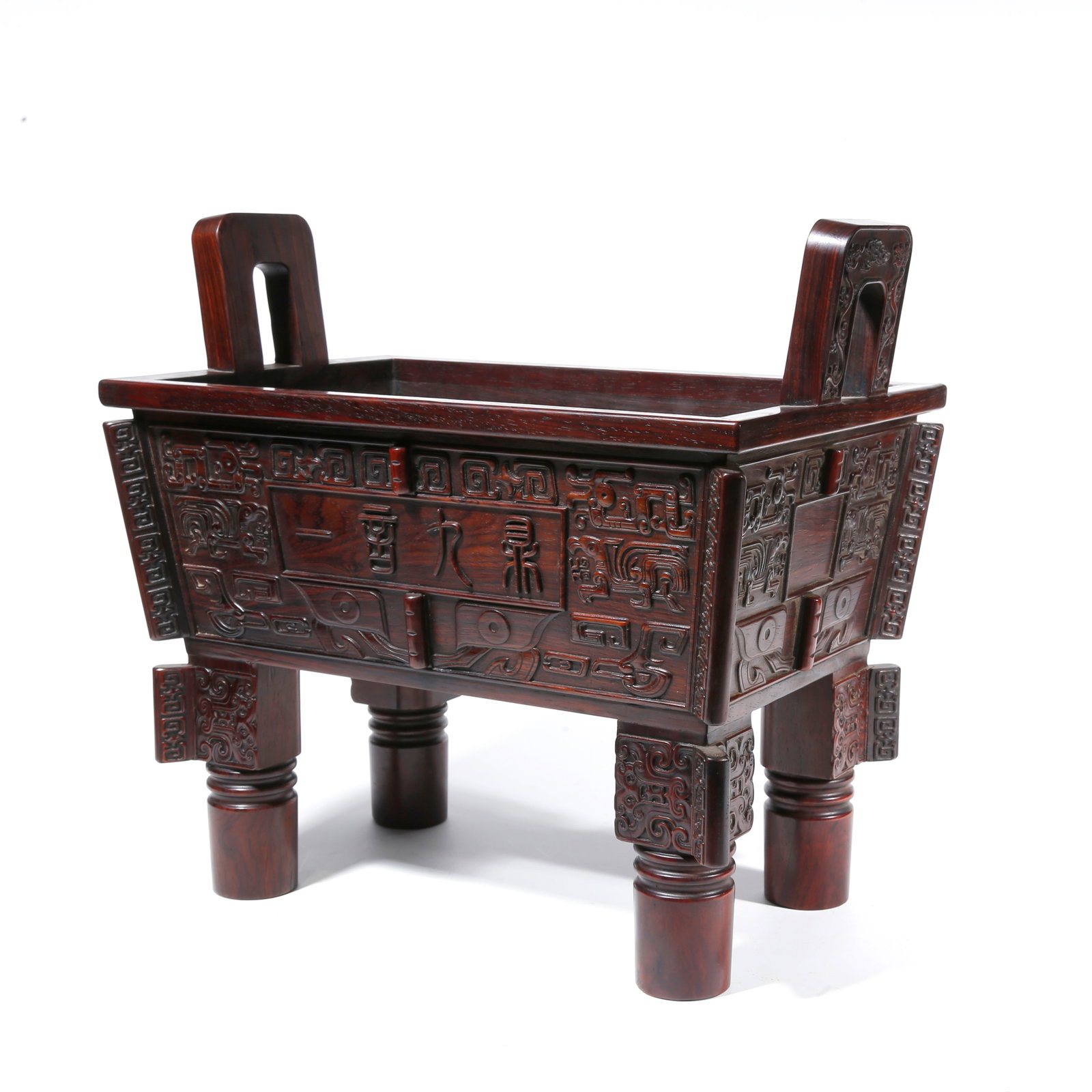 A RED SANDALWOOD CARVED TRIPOD WITH UPRIGHT EARS (1 of 9)