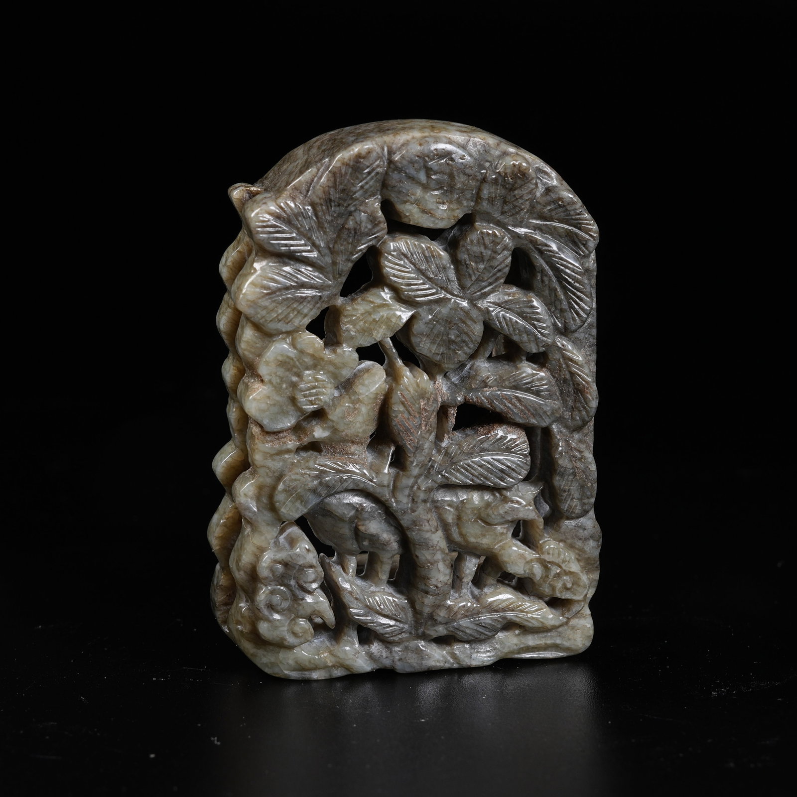 A HETIAN JADE BELT ORNAMENT WITH AUTUMN MOUNTAIN SCENE: Hetian Jade Belt Ornament with Autumn Mountain Scene