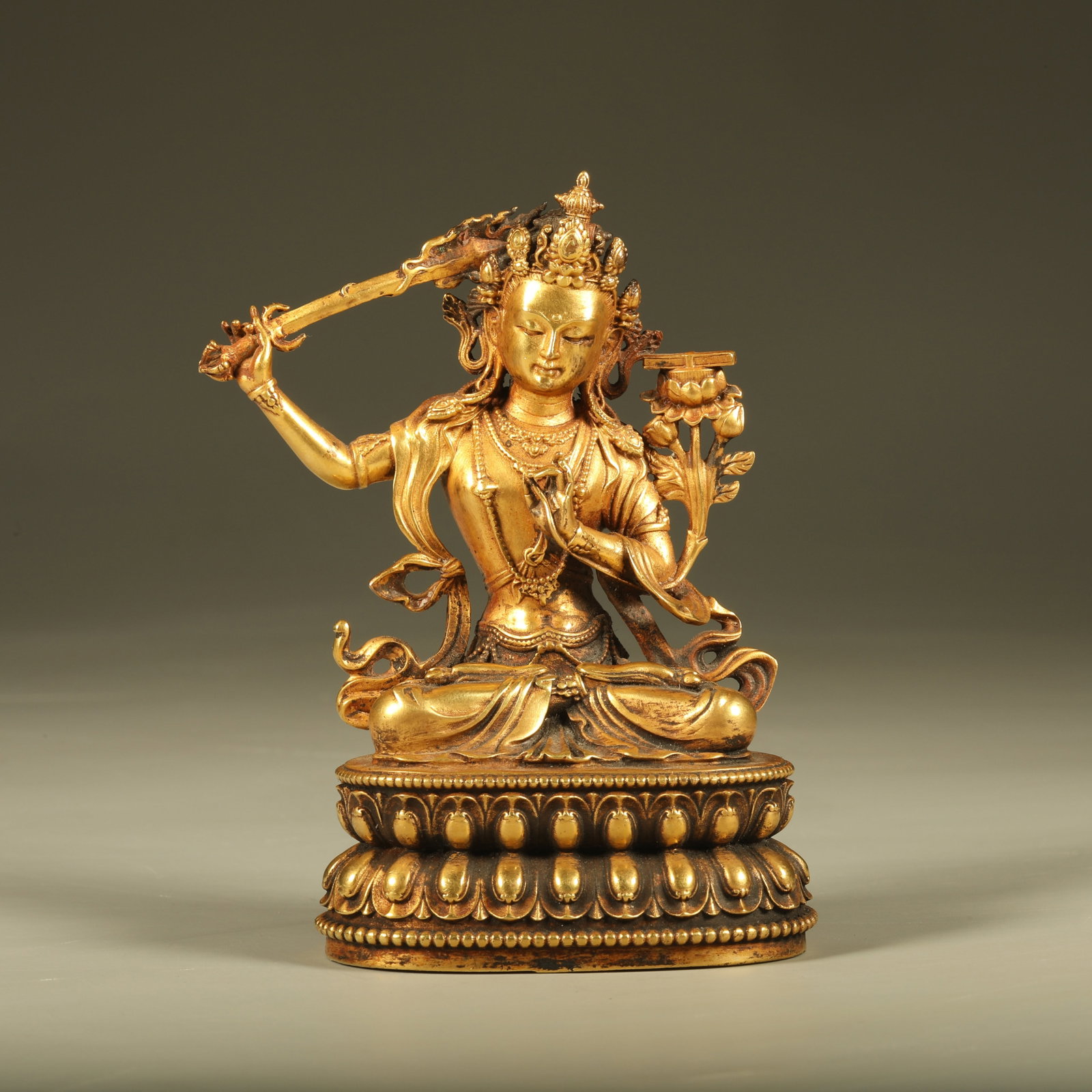 A GILT BRONZE STATUE OF MANJUSHRI BODHISATTVA: Gilt Bronze Statue of Manjushri Bodhisattva