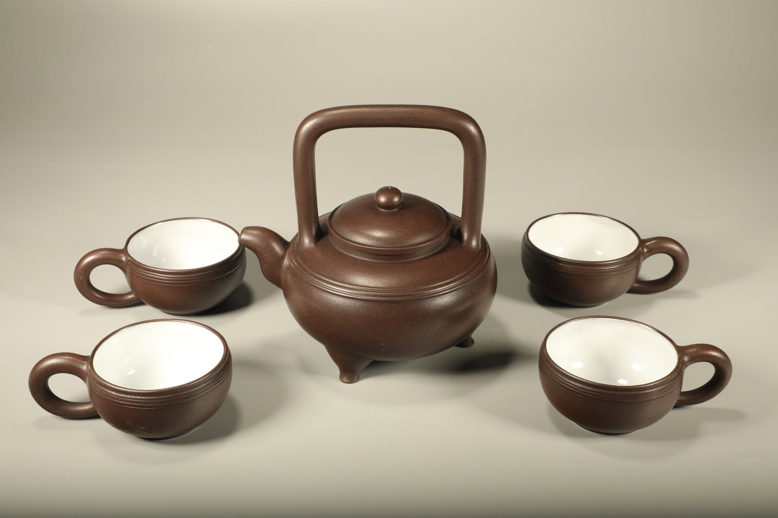 A SET OF FIVE ZISHA HIGH-LINE THREE-LEGGED BAILI TEAPOTS: Set of Five Zisha High-line Three-legged Baili Teapots