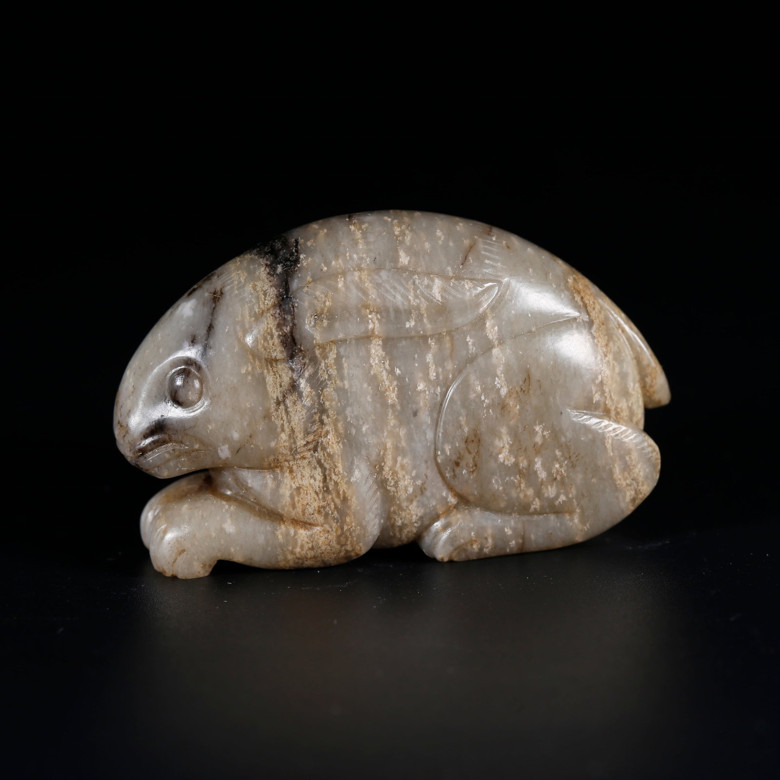 A HETIAN JADE CARVED RABBIT ORNAMENT (1 of 9)