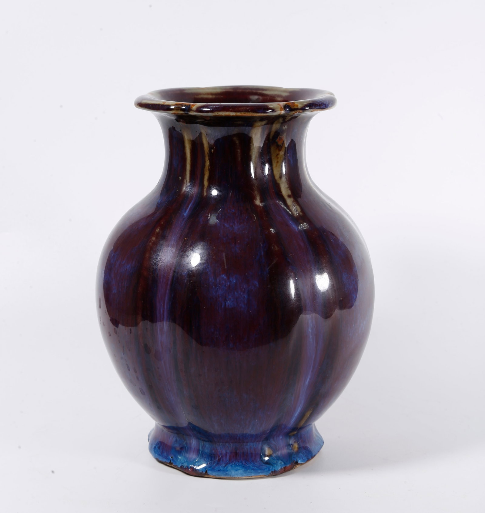 A FLAMBE GLAZE FLORAL-RIMMED VASE: Flambe Glaze Floral-rimmed Vase