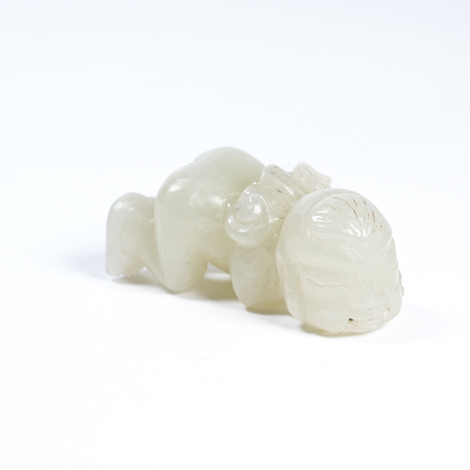 A HETIAN JADE RECLINING BOY ORNAMENT (1 of 8)