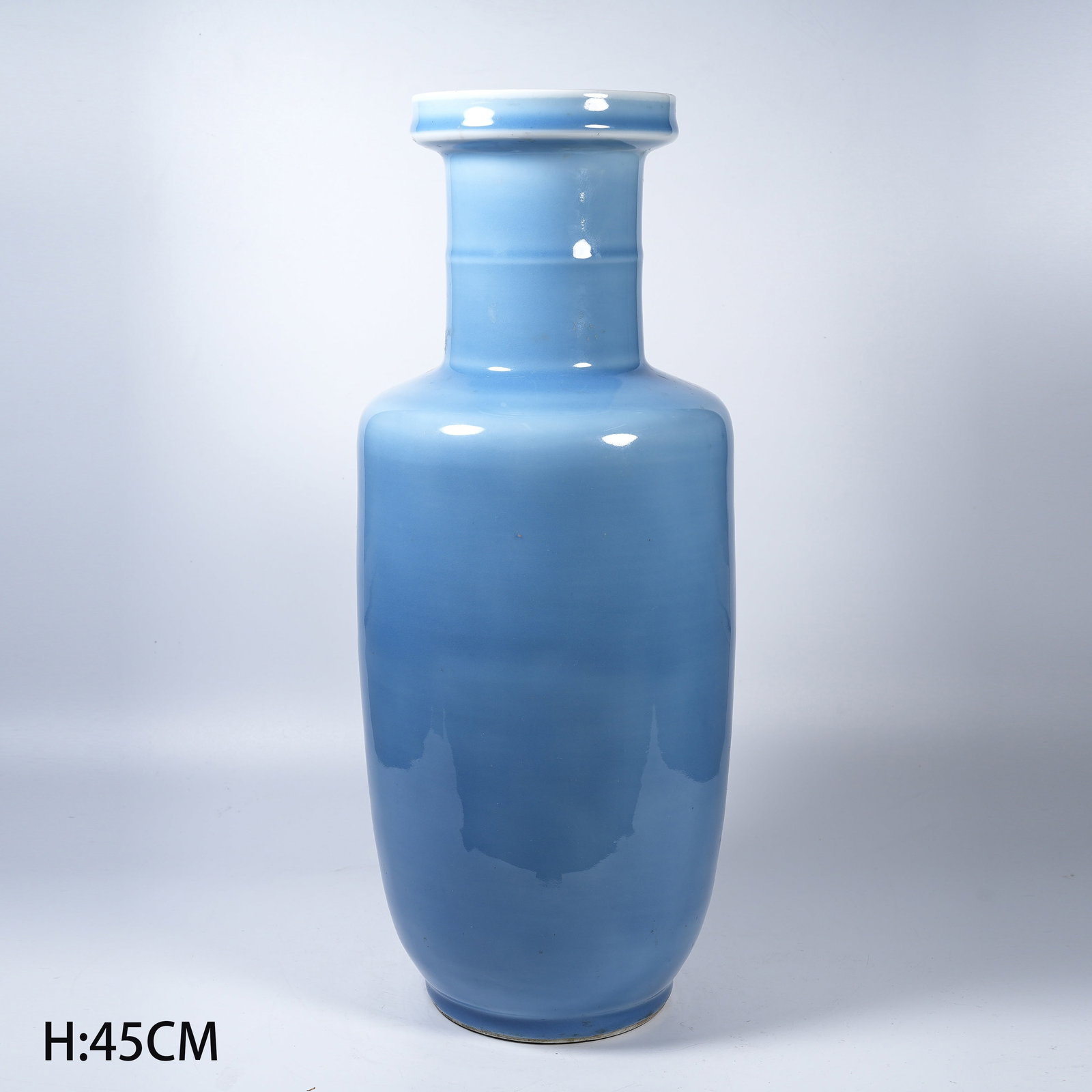 A SKY BLUE GLAZE CLUB-SHAPED VASE: Sky Blue Glaze Club-Shaped Vase