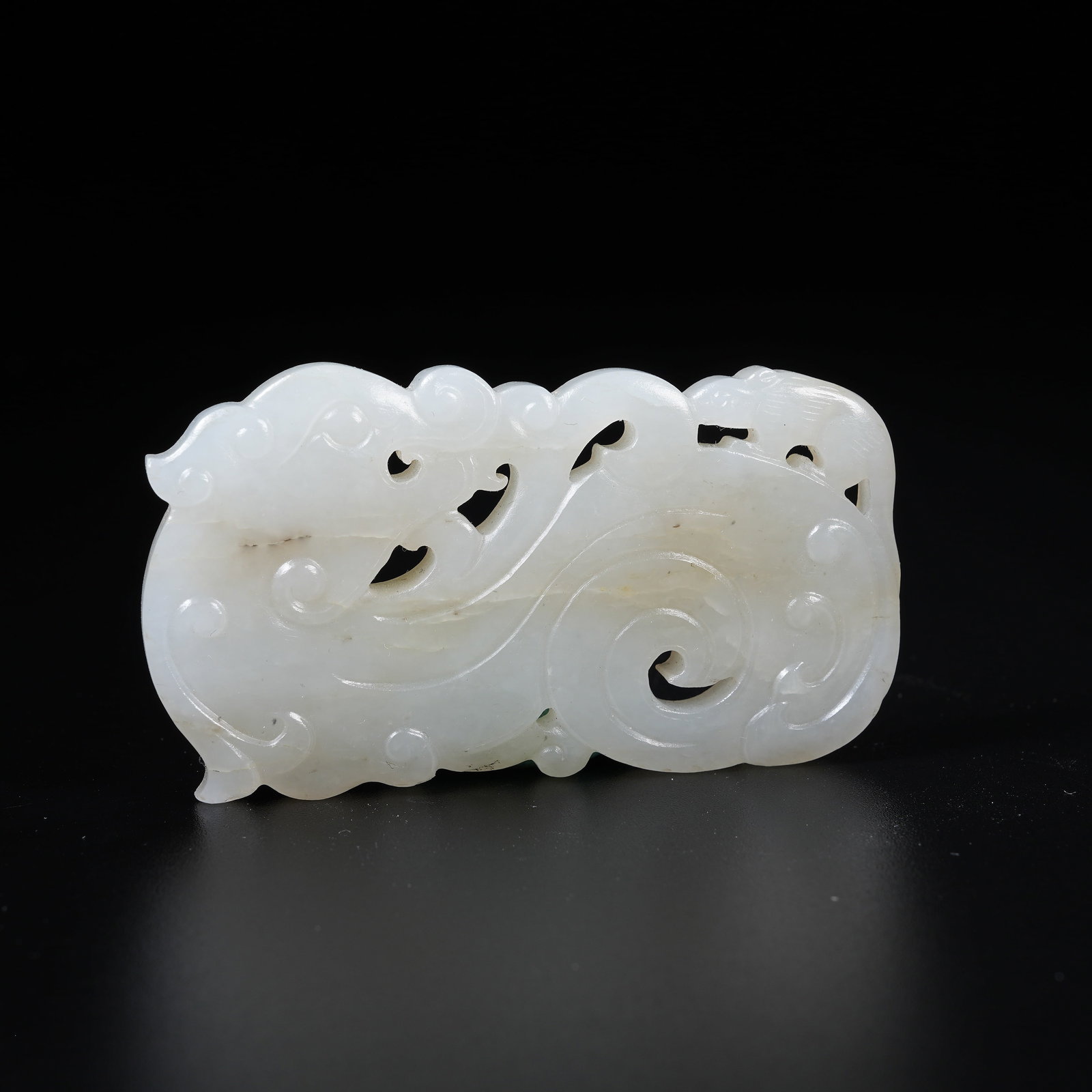 A HETIAN JADE PENDANT WITH DRAGON PATTERN: Hetian Jade Pendant with Dragon Pattern