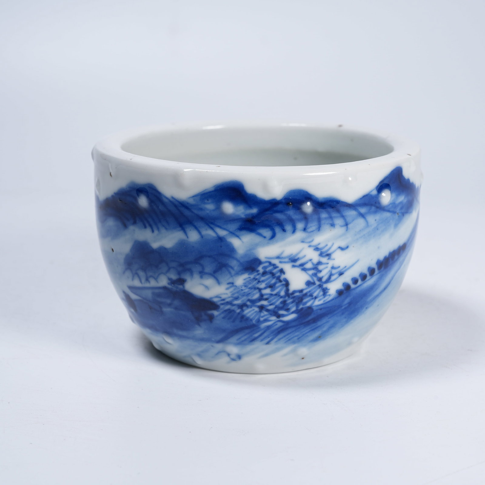A BLUE AND WHITE BARREL SHAPED BASIN WITH LANDSCAPE, PAVILION AND STUD NAIL PATTERNS: Blue and White Barrel Shaped Basin with Landscape, Pavilion and Stud Nail Patterns