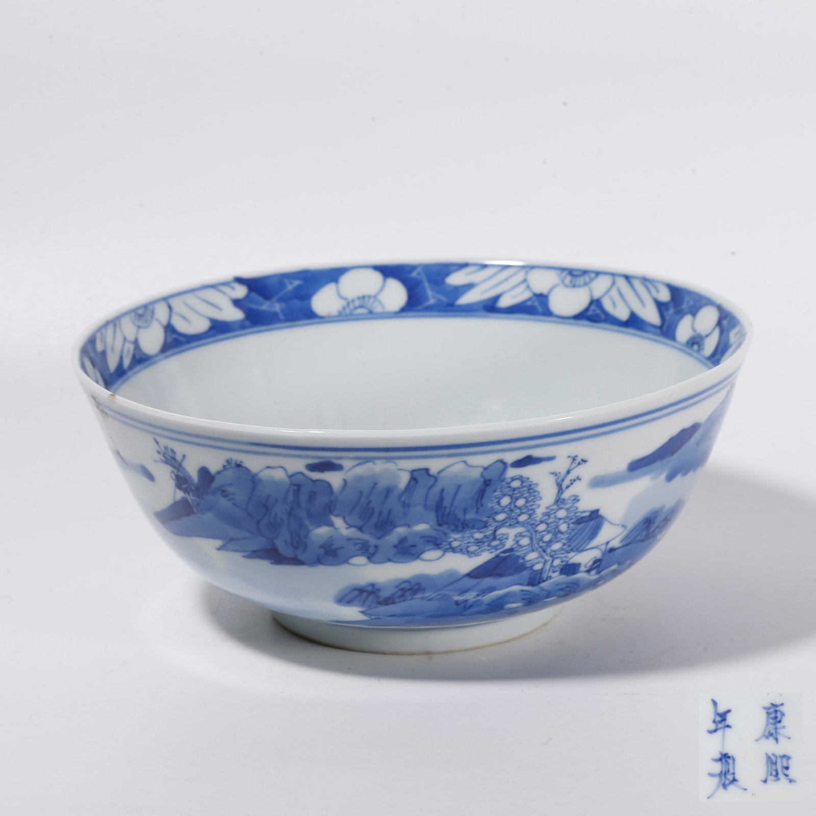 A BLUE AND WHITE BOWL WITH LANDSCAPE PATTERNS: Blue and White Bowl with Landscape Patterns