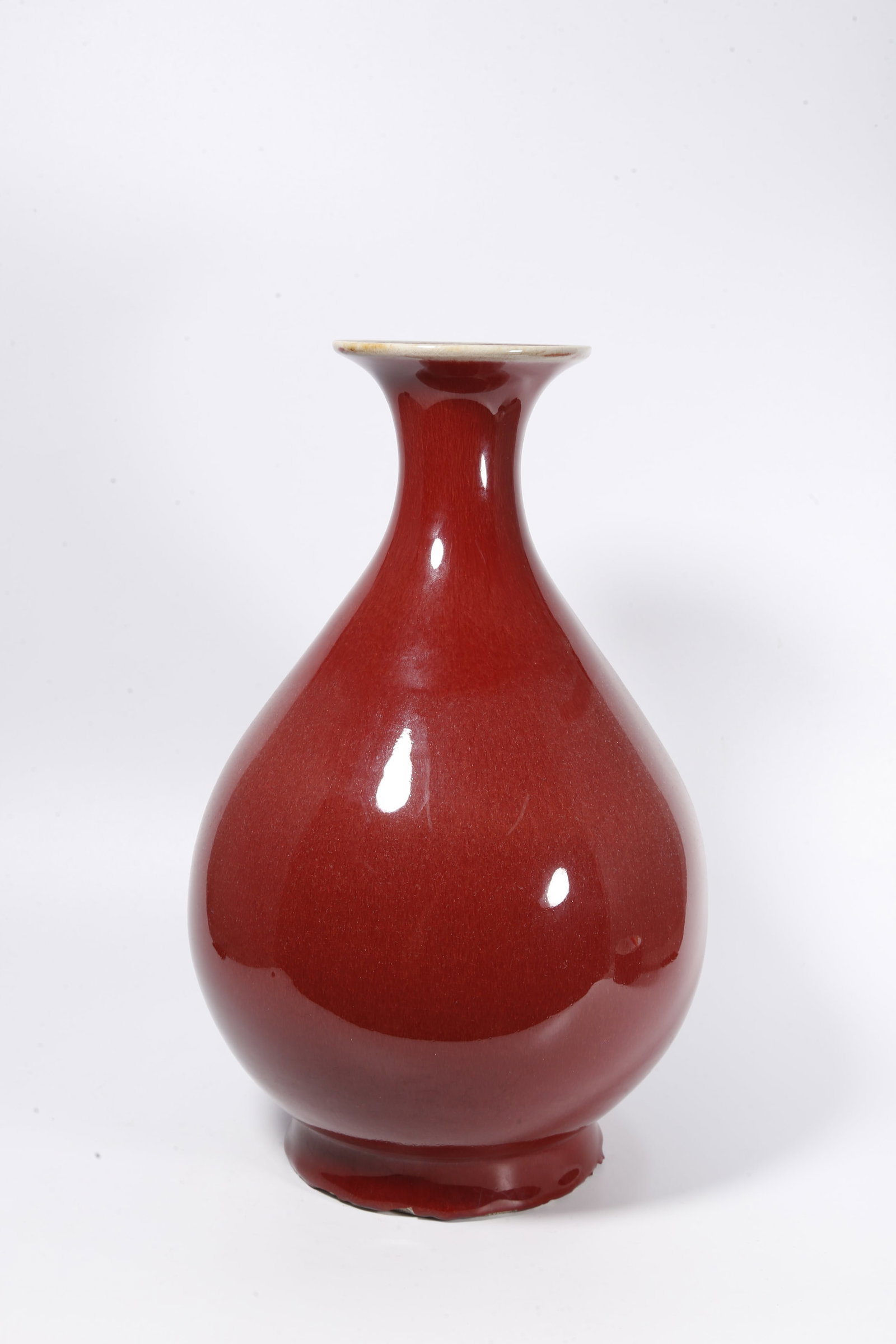 A RED GLAZE PEAR-SHAPED VASE: Red Glaze Pear-Shaped Vase