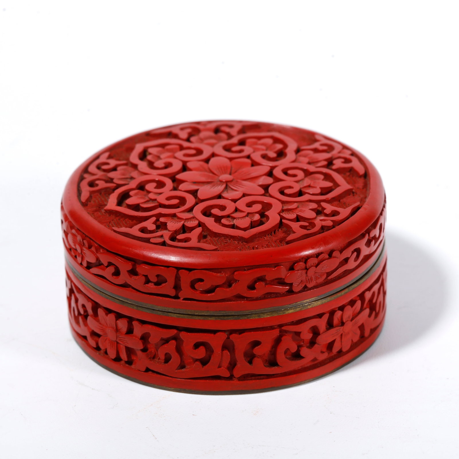 A CARVED RED LACQUER COVERED BOX WITH FLORAL PATTERNS: Carved Red Lacquer Covered Box with Floral Patterns
