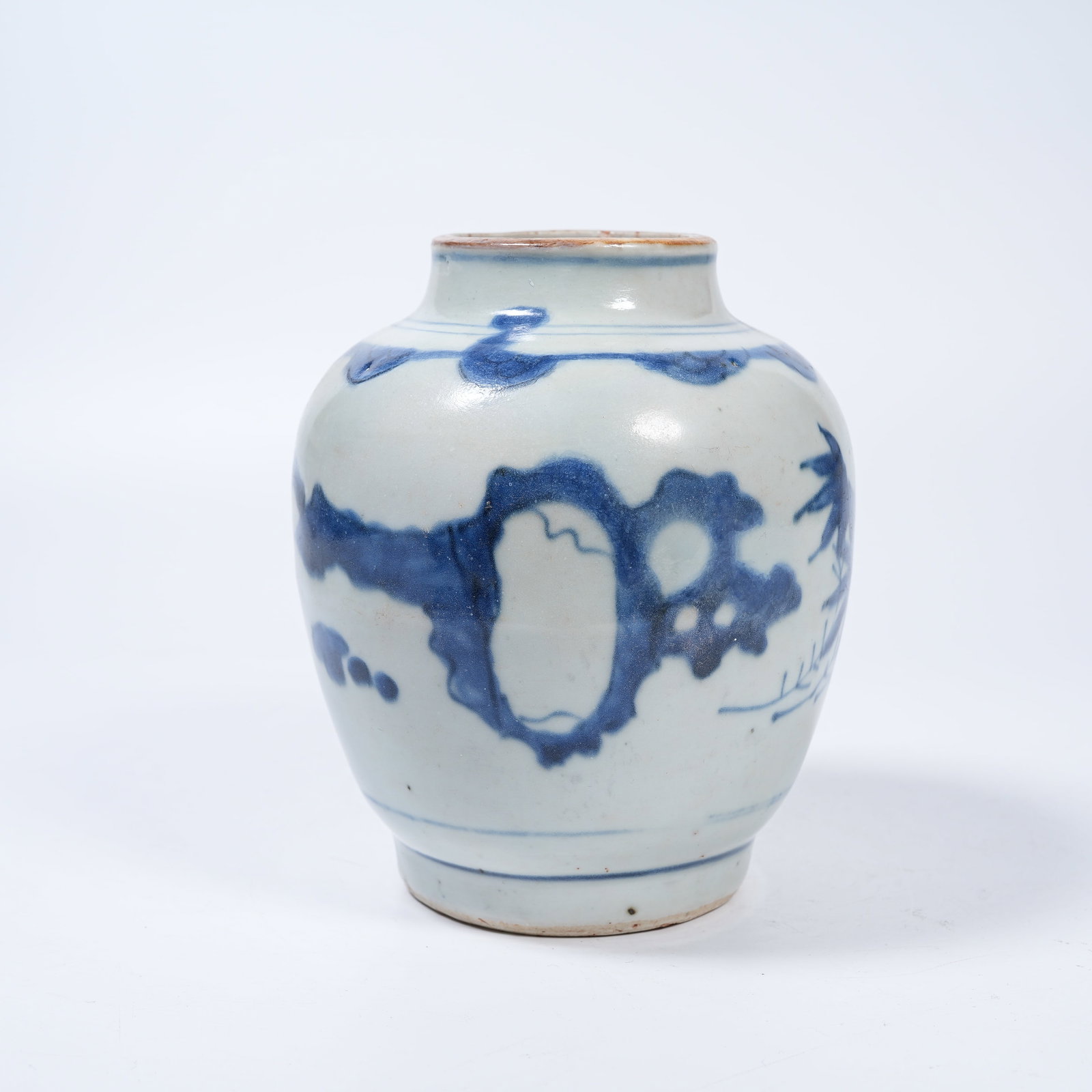 A BLUE AND WHITE JAR WITH ROCK AND FLORAL PATTERNS: Blue and White Jar with Rock and Floral Patterns