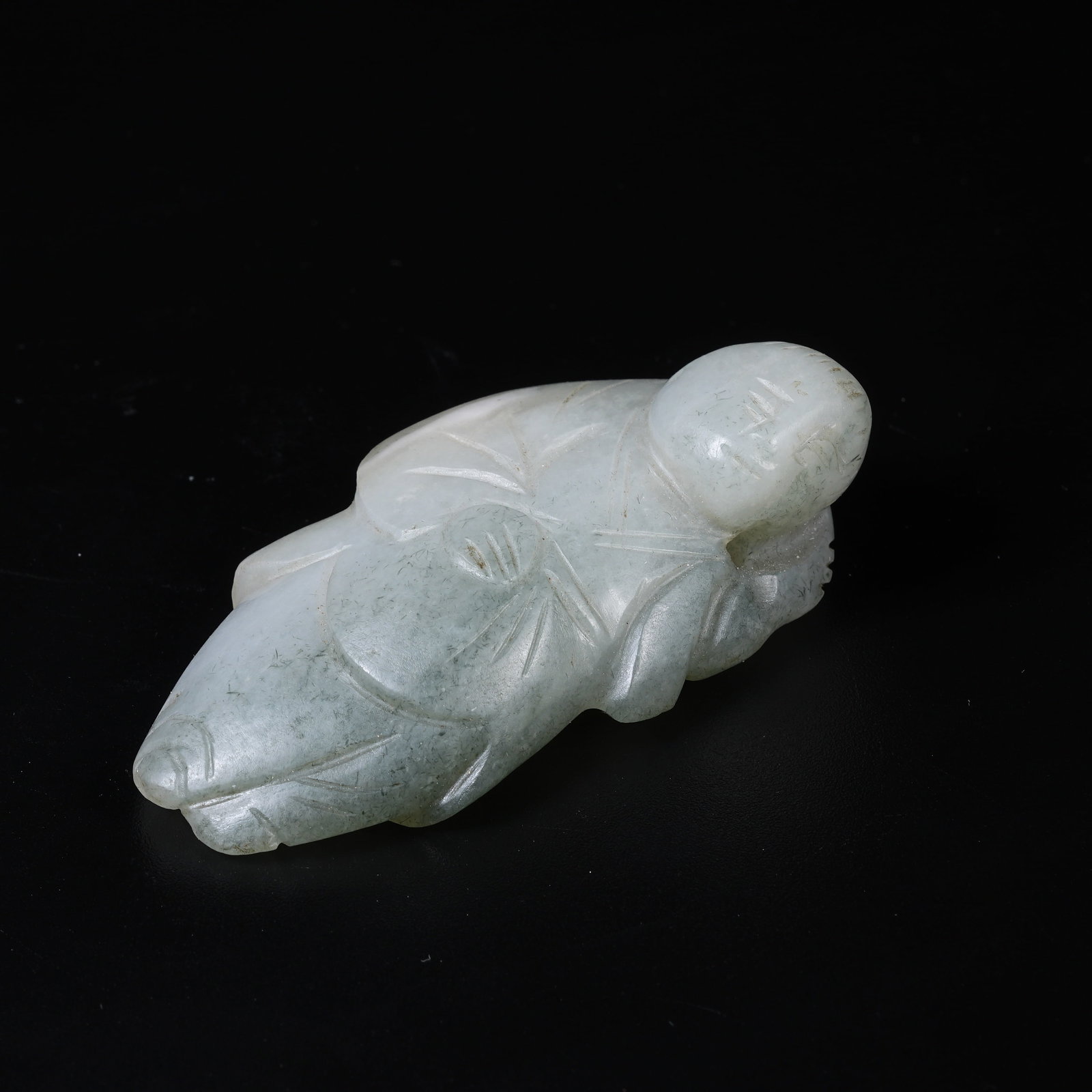 A HETIAN JADE HUMAN FIGURE PENDANT: Hetian Jade Human Figure Pendant