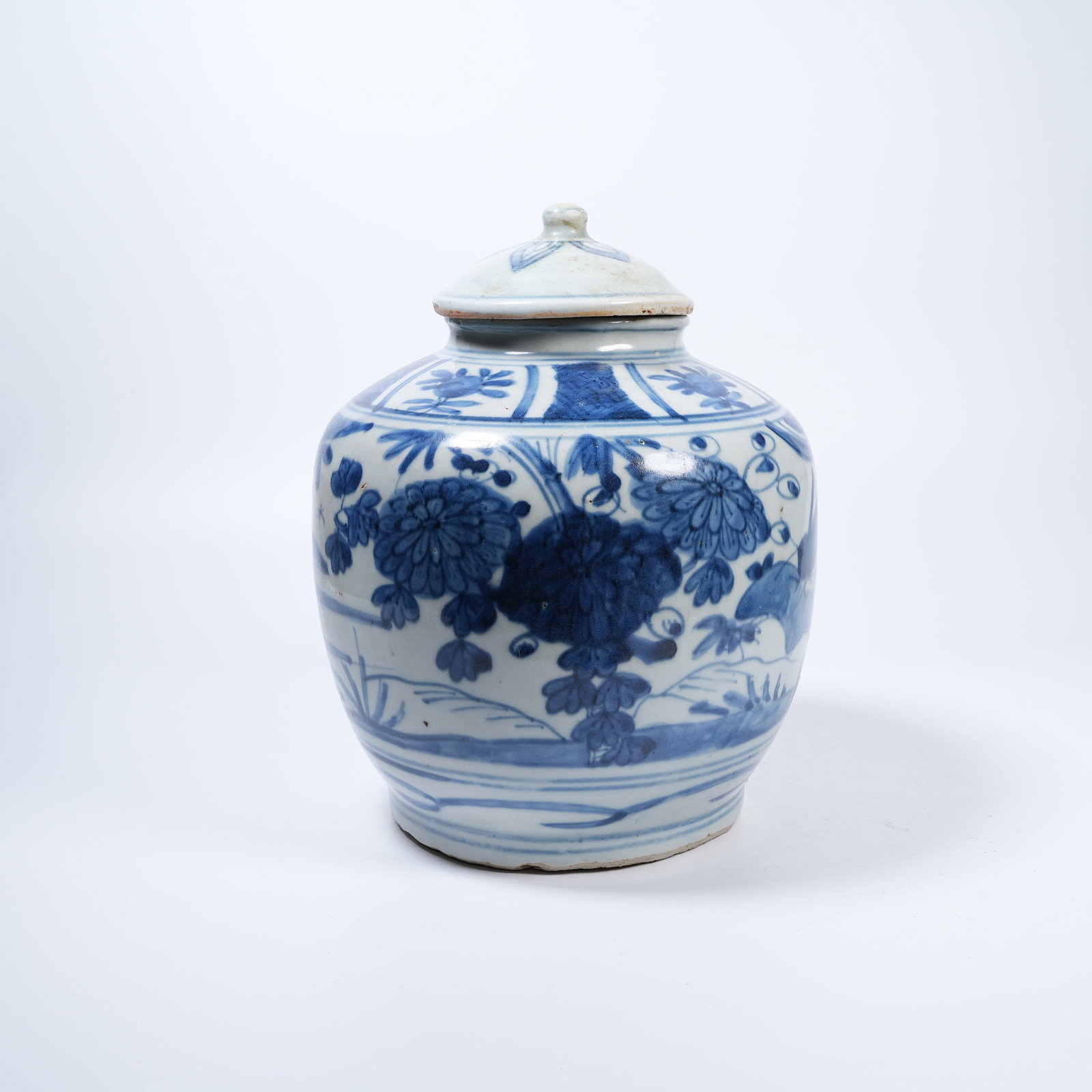 A BLUE AND WHITE COVERED JAR WITH FLORAL PATTERNS (1 of 9)