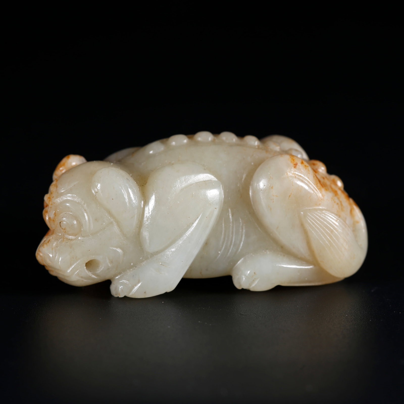 A HETIAN JADE CARVED BEAST ORNAMENT: Hetian Jade Carved Beast Ornament