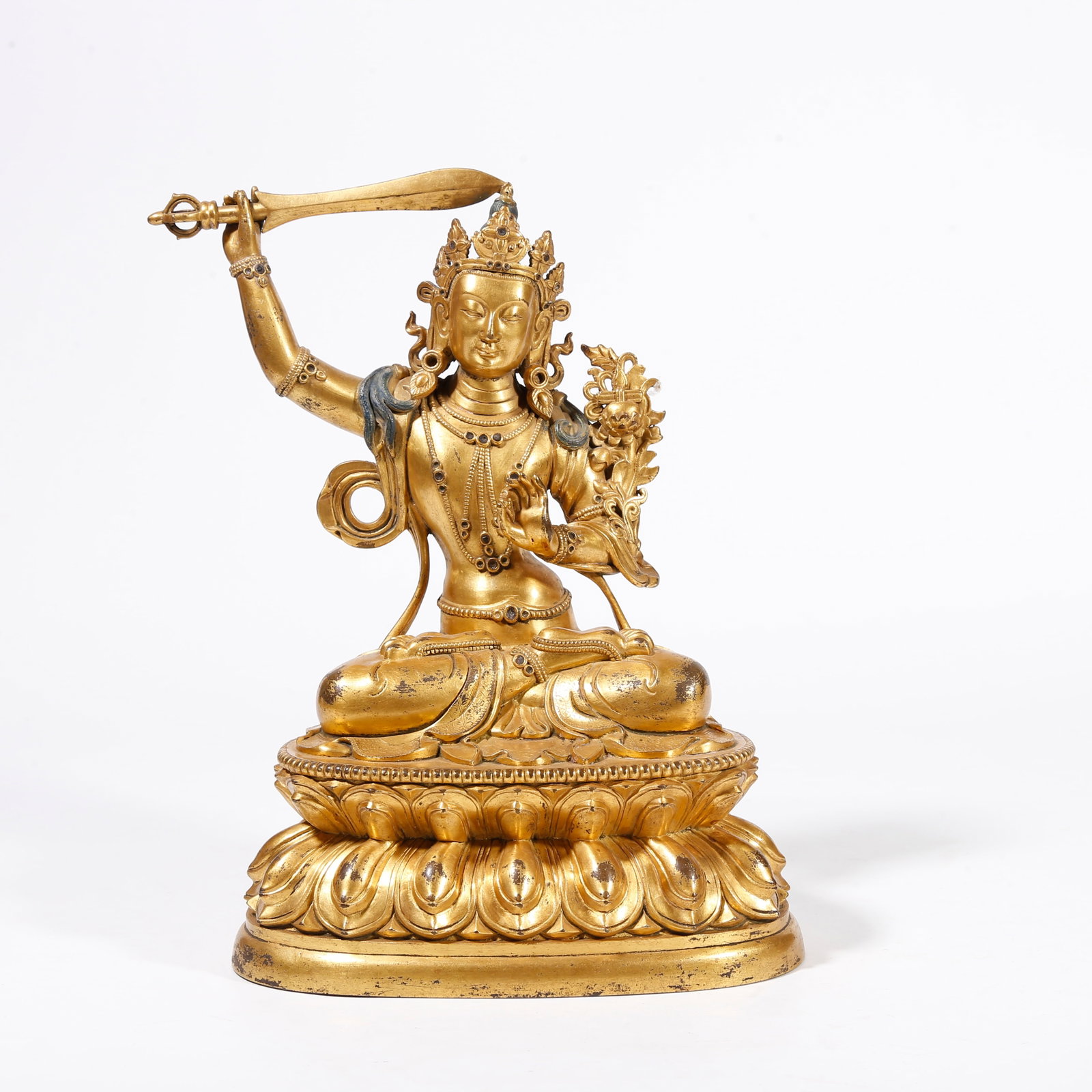 A GILDED BRONZE STATUE OF SWORD-HOLDING MANJUSHRI: Gilded Bronze Statue of Sword-Holding Manjushri