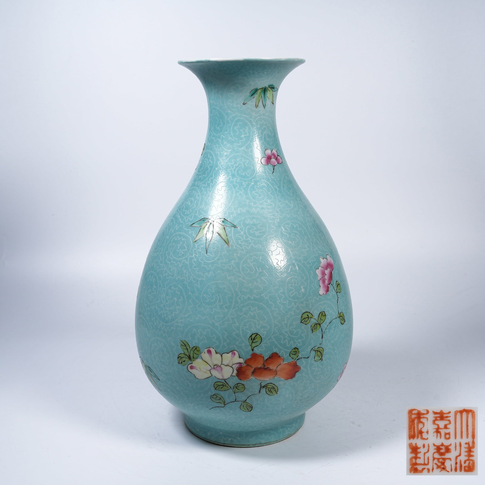 A TURQUOISE GROUND GRAINED FAMILLE ROSE PEAR SHAPED VASE WITH FLORAL PATTERNS: Turquoise Ground Grained Famille Rose Pear Shaped Vase with Floral Patterns