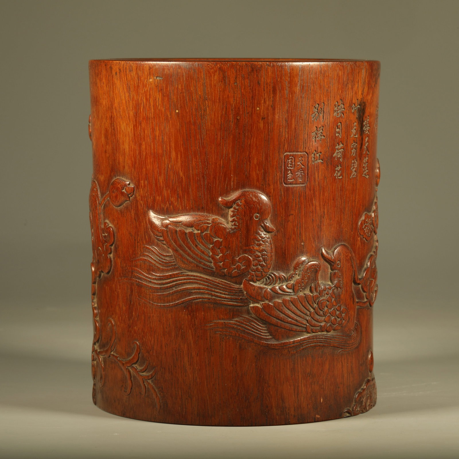 A PADAUK BRUSH POT CARVED WITH PEONY BLOSSOMS: Padauk Brush Pot Carved with Peony Blossoms