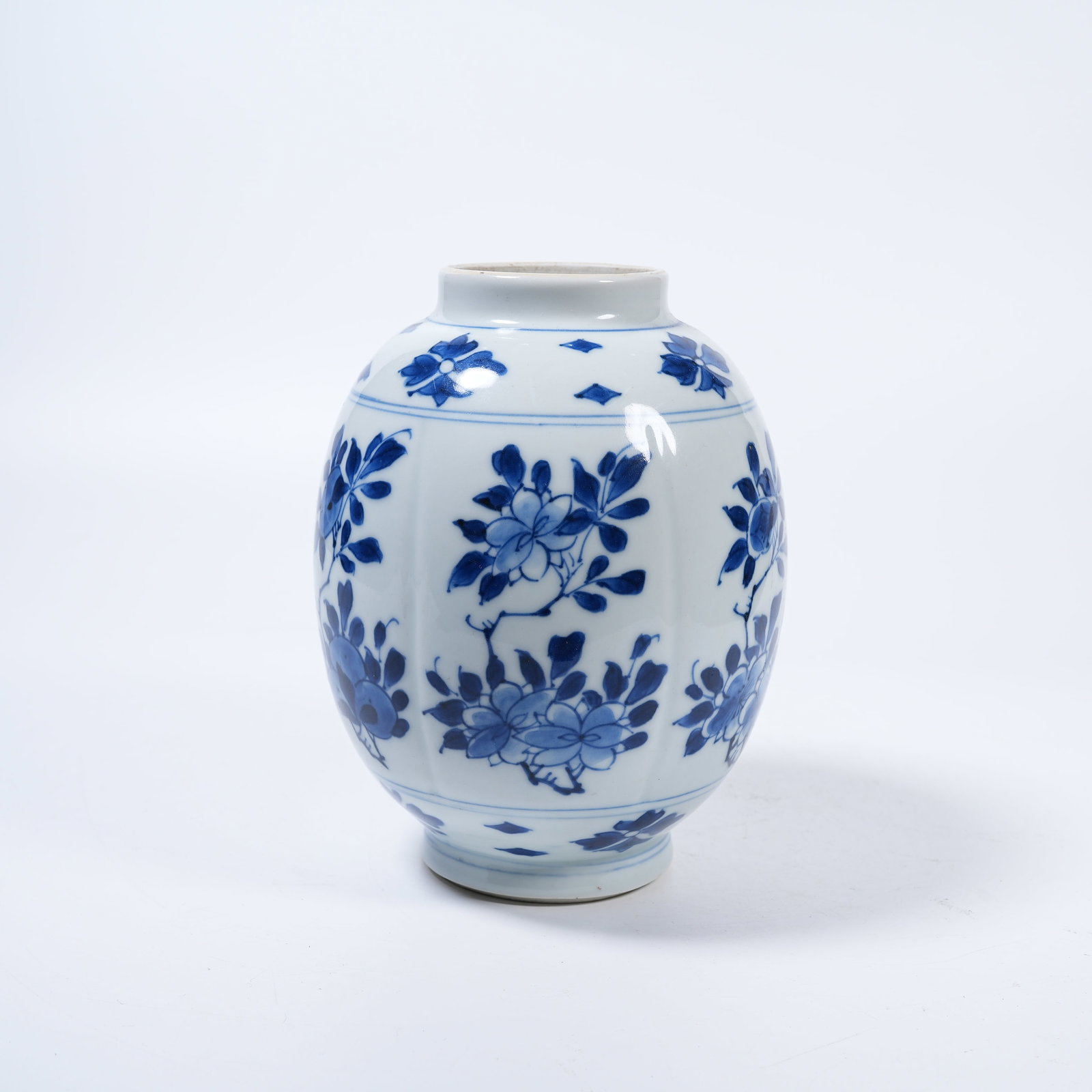 A BLUE AND WHITE JAR WITH FLORAL PATTERNS (1 of 9)