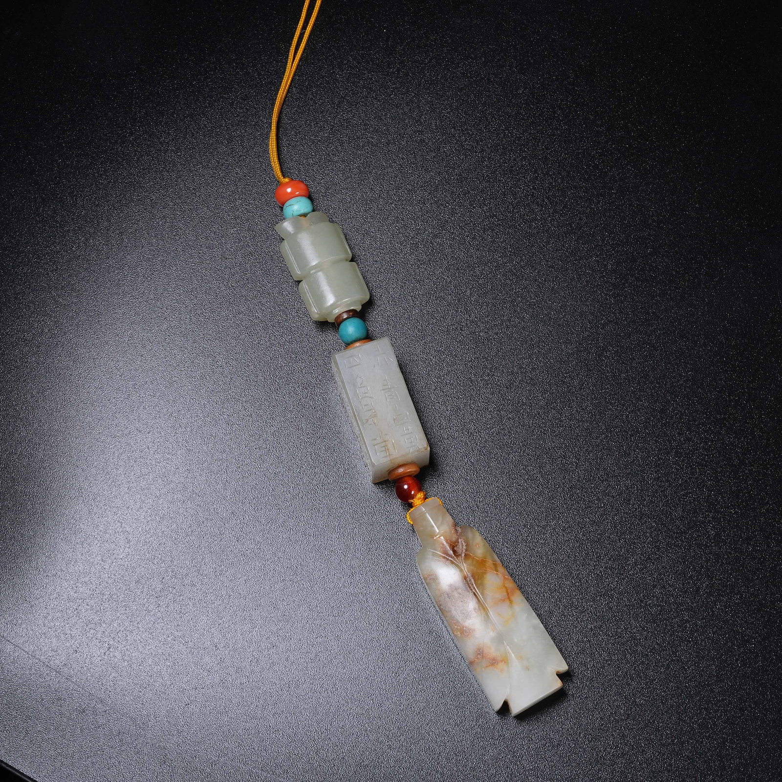 A SET OF ANCIENT JADE HANGING ORNAMENTS OF THREE AUSPICIOUS TREASURES (1 of 10)