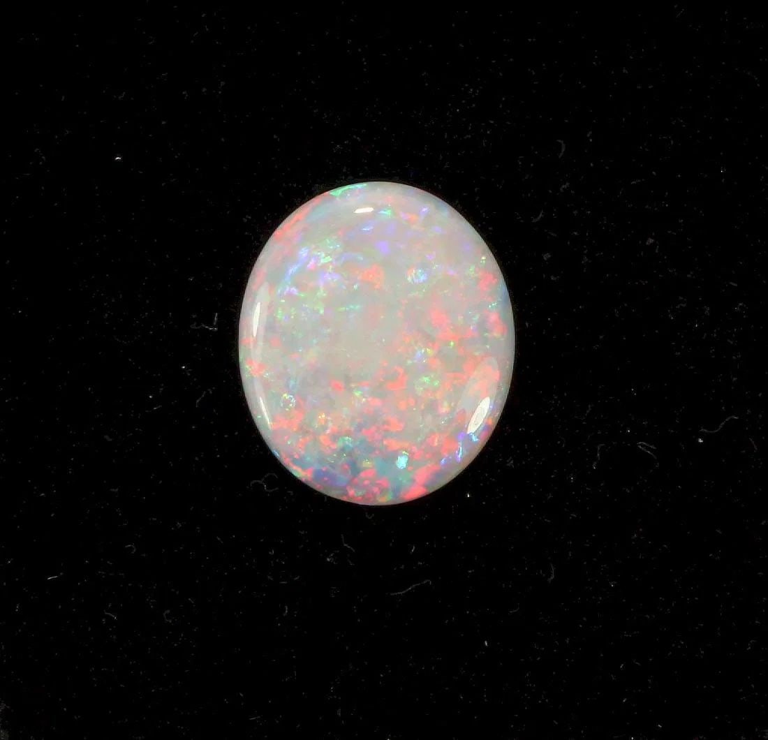 AUSTRALIAN OVAL-SHAPED SEMI-BLACK SOLID OPAL: Australian Oval-shaped Semi-Black Solid Opal