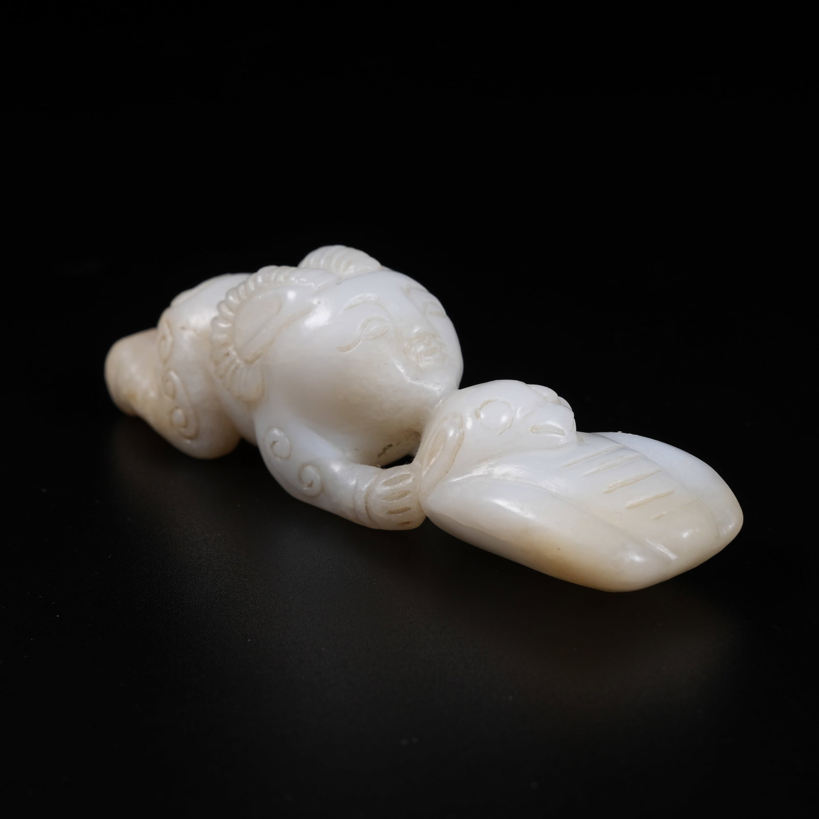 A ARCHAIC JADE DIVINE BEAST ORNAMENT: Archaic Jade Divine Beast Ornament