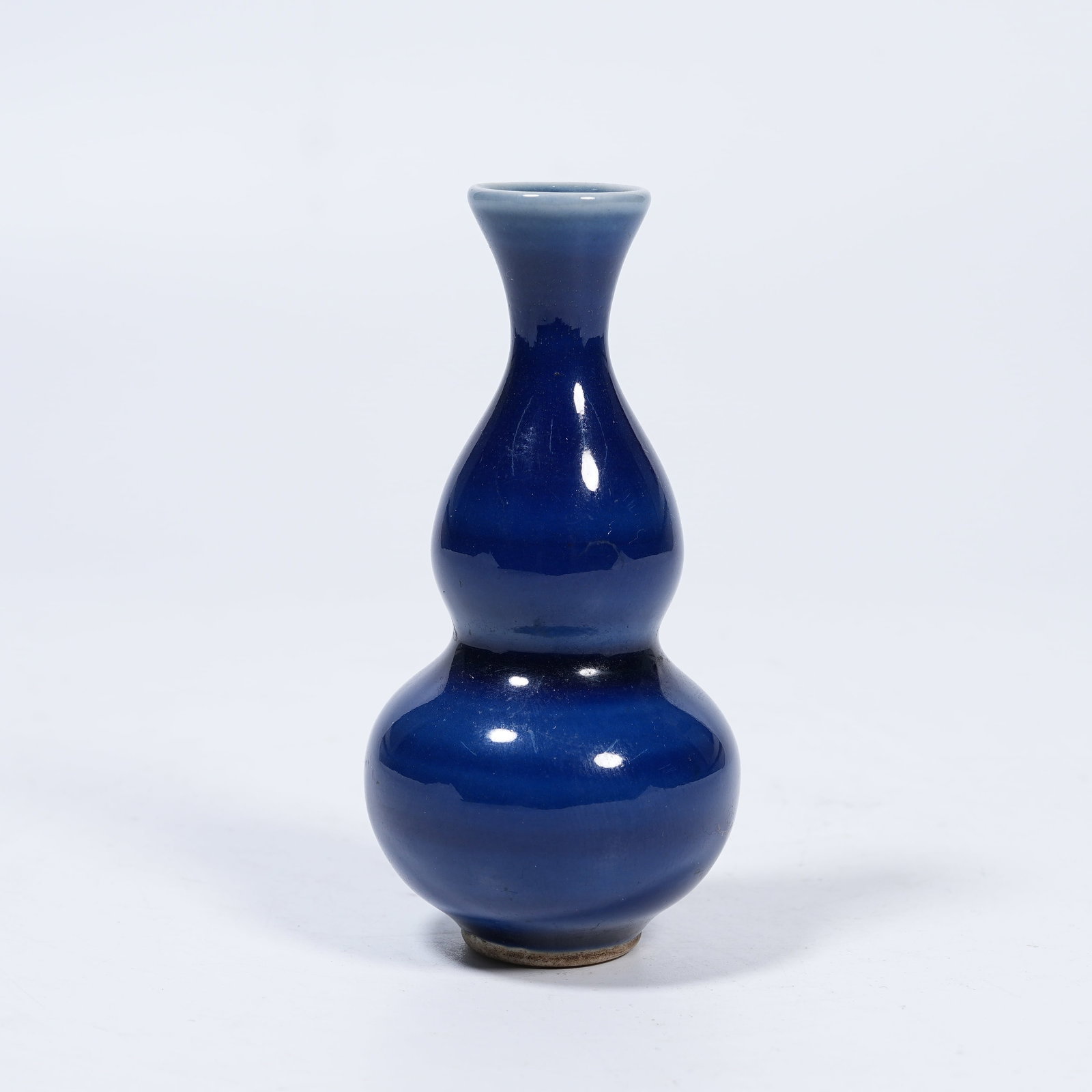 A SMALL SACRIFICIAL BLUE GLAZE GOURD VASE: Small Sacrificial Blue Glaze Gourd Vase