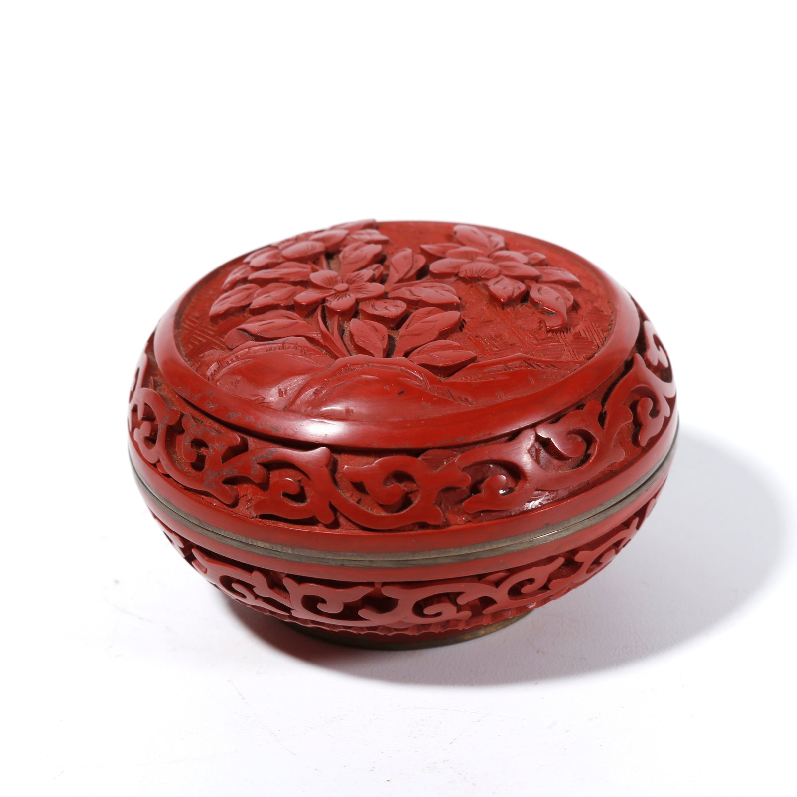 A CARVED RED LACQUER COVERED BOX WITH FLORAL PATTERNS (1 of 8)