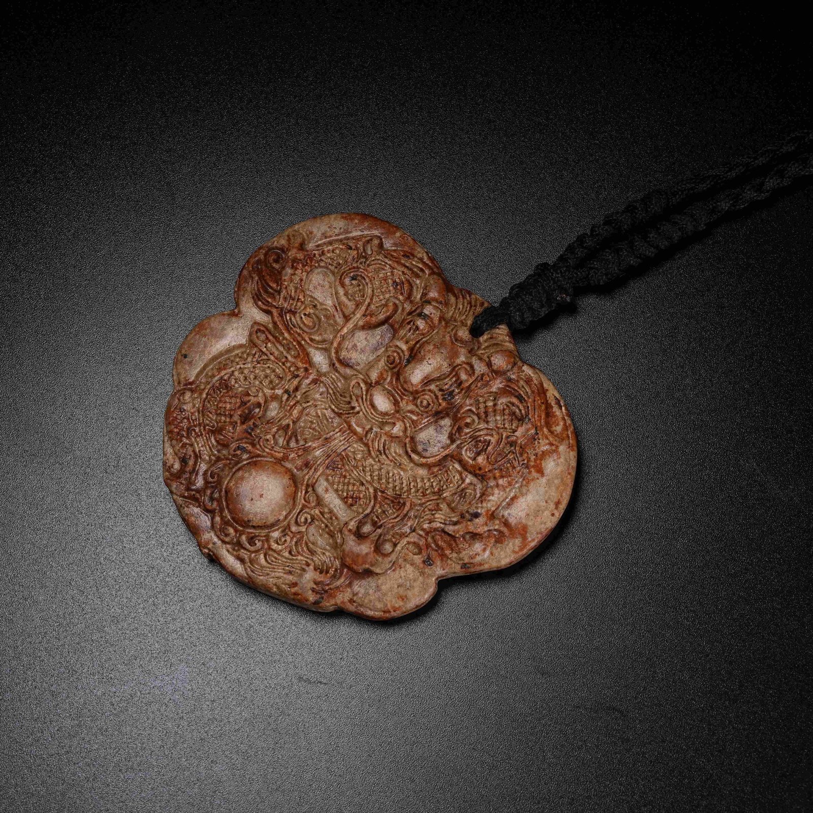 A ARCHAIC JADE PENDANT WITH DRAGON PATTERN: Archaic Jade Pendant with Dragon Pattern