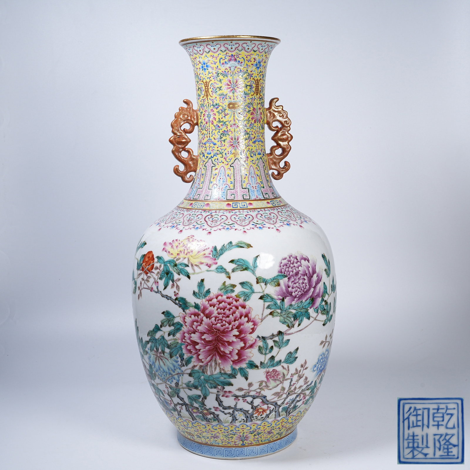 A FAMILLE ROSE DRAGON-EARED VASE WITH FLORAL PATTERNS: Famille Rose Dragon-Eared Vase with Floral Patterns