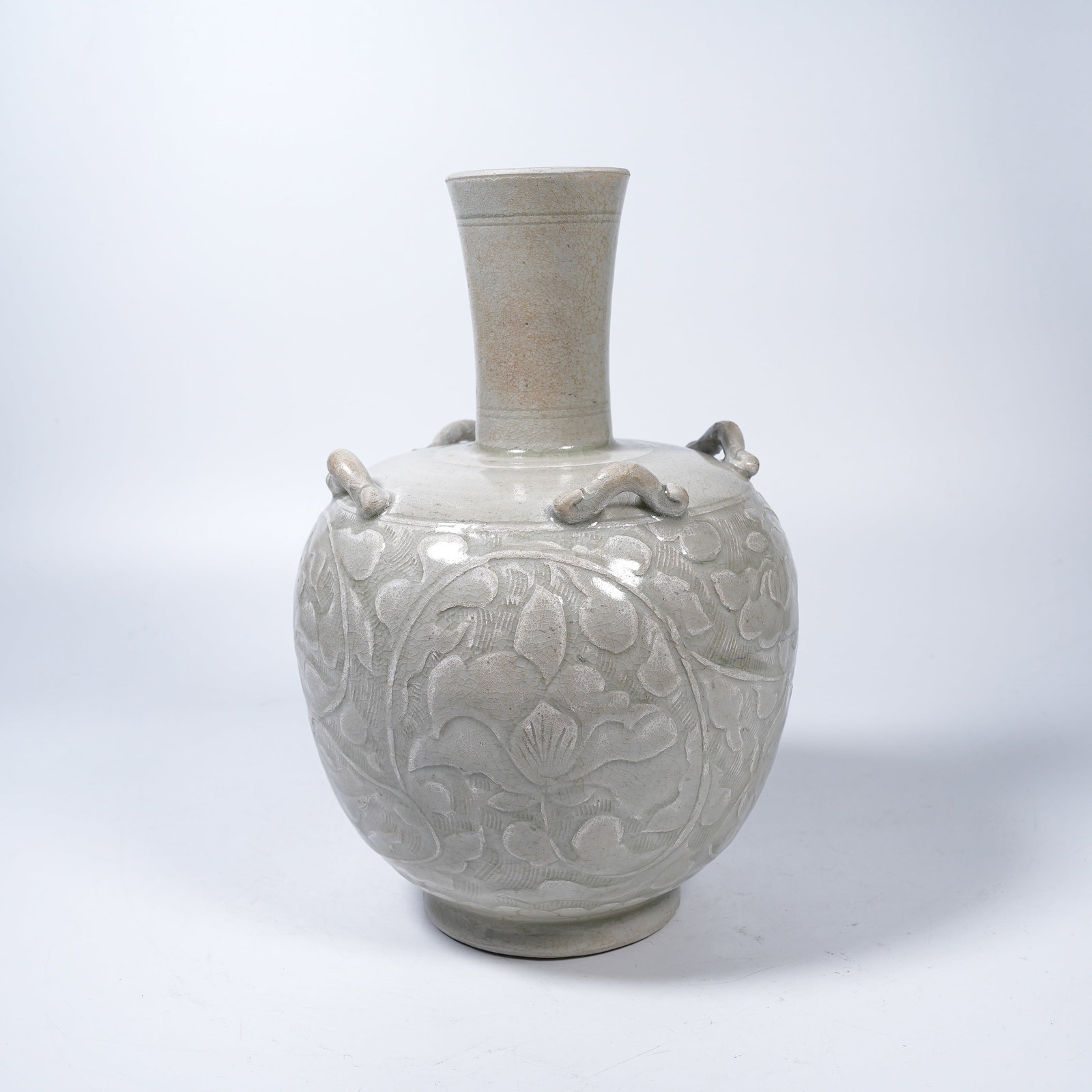 A DING KILN CARVED FOUR-LUG LONG-NECK VASE: Ding Kiln Carved Four-Lug Long-Neck Vase