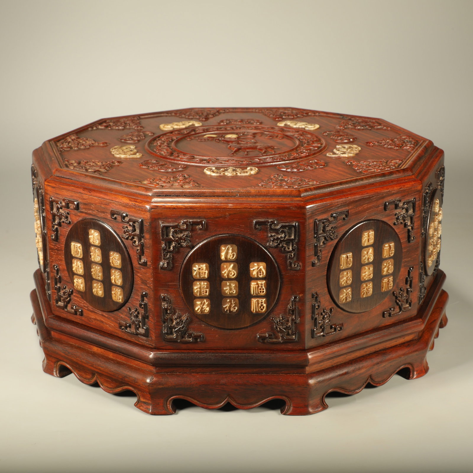 A PADAUK COVERED BOX CARVED WITH FU, LU AND SHOU MOTIFS: Padauk Covered Box Carved with Fu, Lu and Shou Motifs