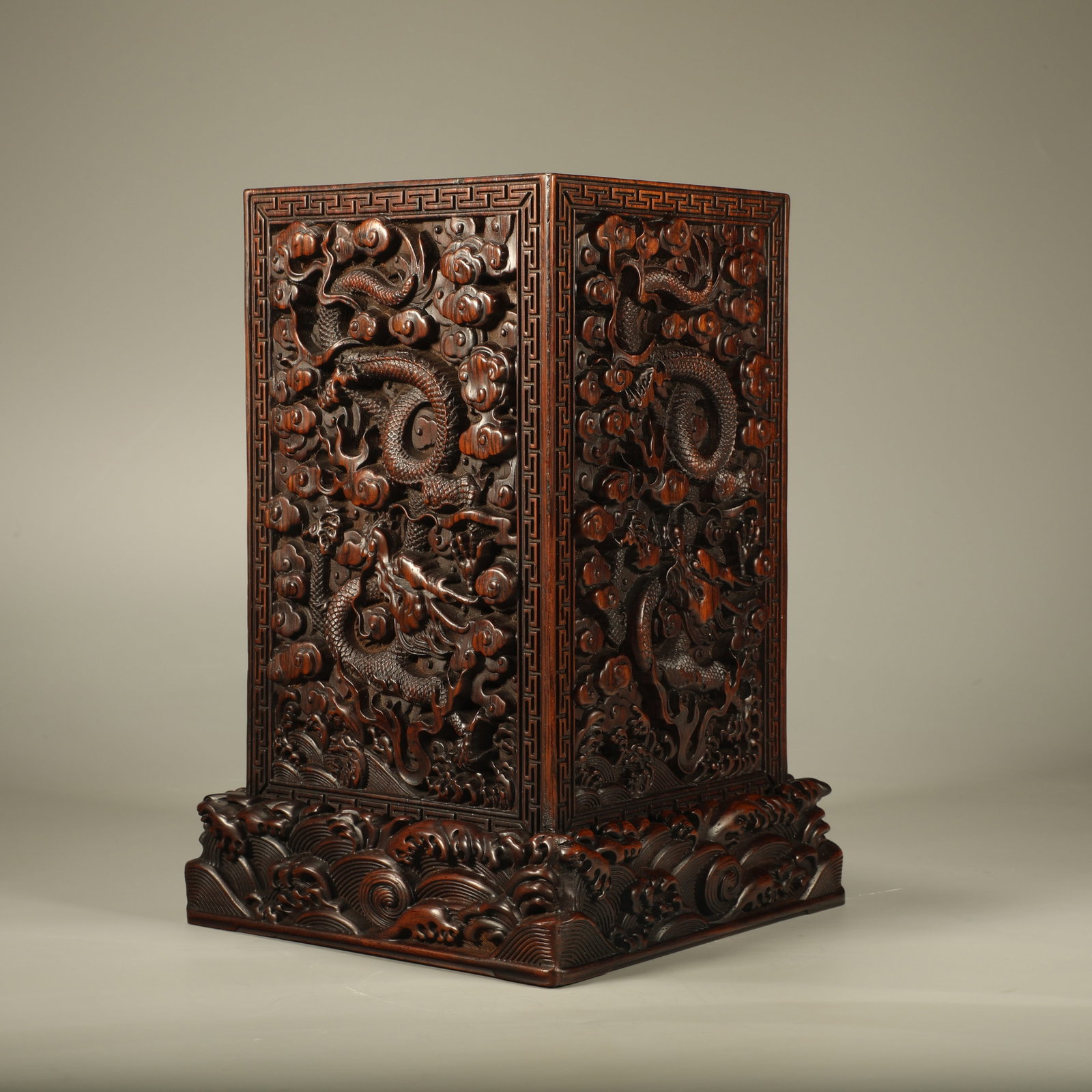 A SQUARE PADAUK BRUSH POT CARVED WITH DRAGON PATTERNS: Square Padauk Brush Pot Carved with Dragon Patterns