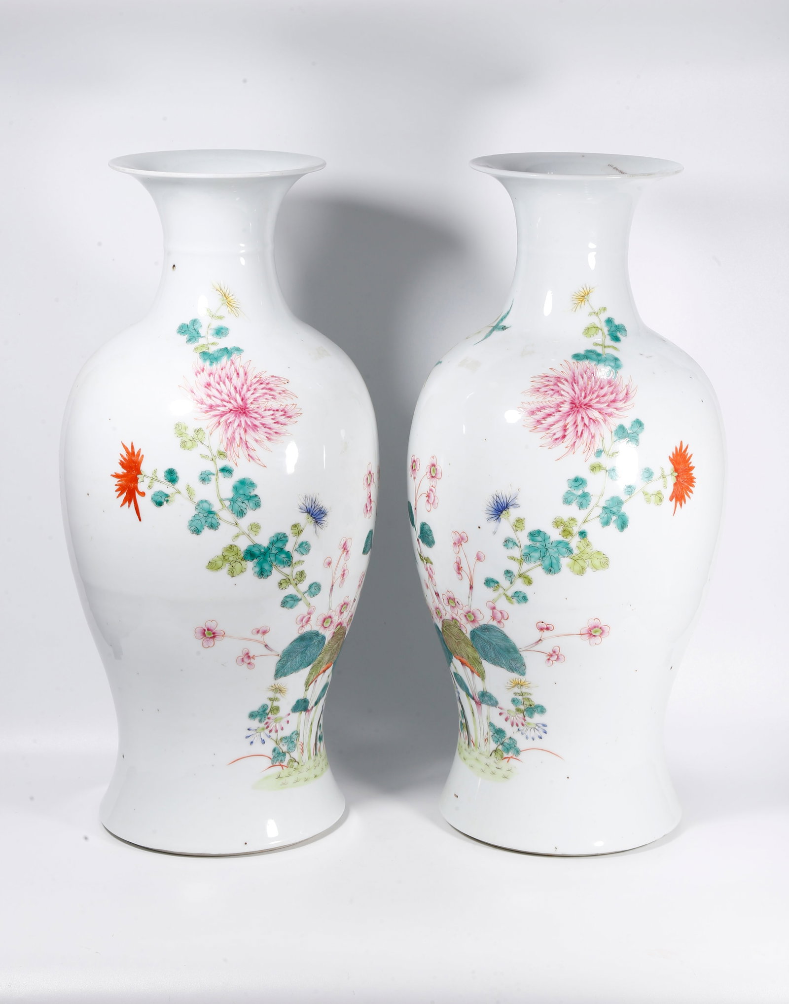 A PAIR OF FAMILLE ROSE GUANYIN VASES WITH FLOWER AND BUTTERFLY PATTERNS: Pair of Famille Rose Guanyin Vases with Flower and Butterfly Patterns