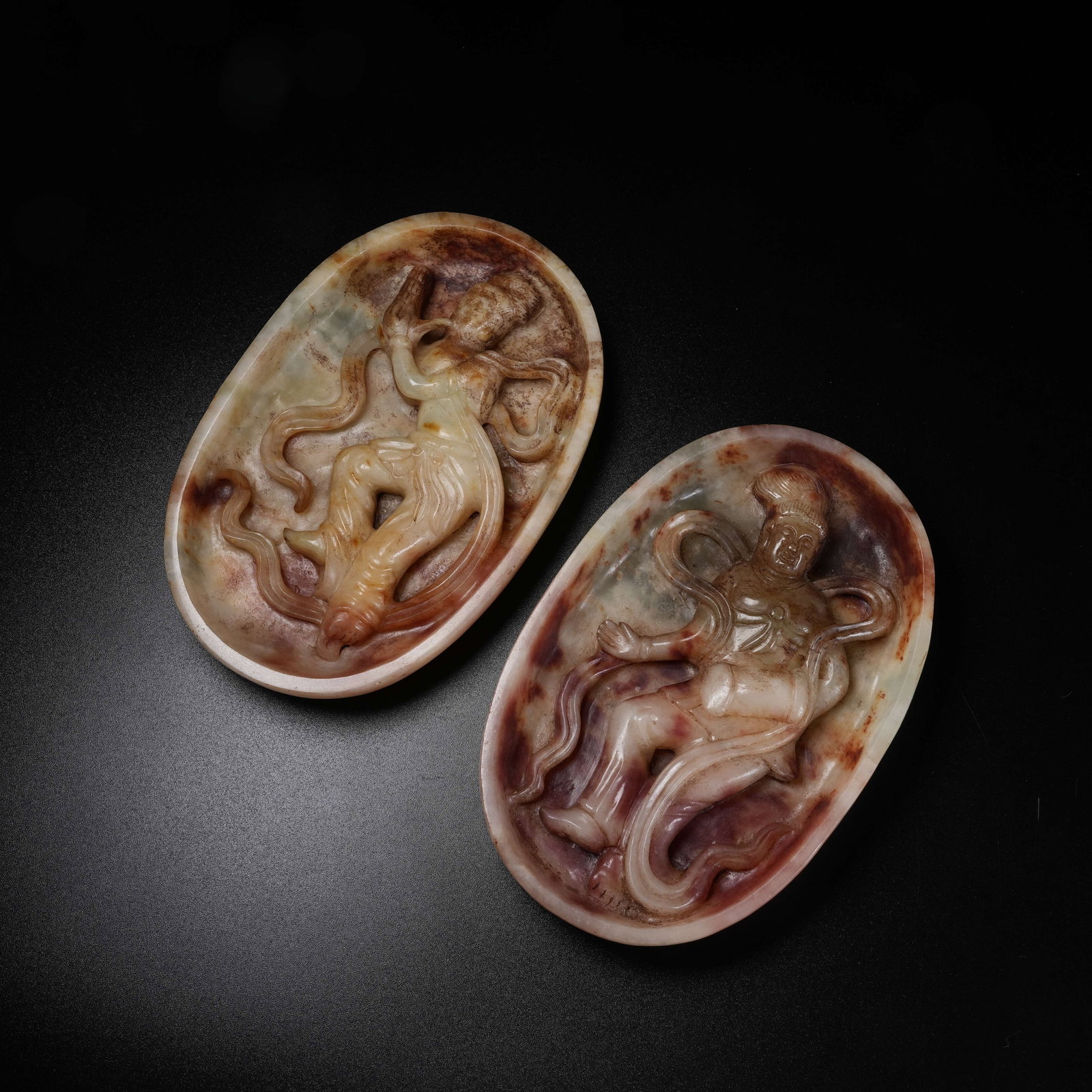 A SET OF ARCHAIC JADE DANCER-SHAPED WASHERS (1 of 10)