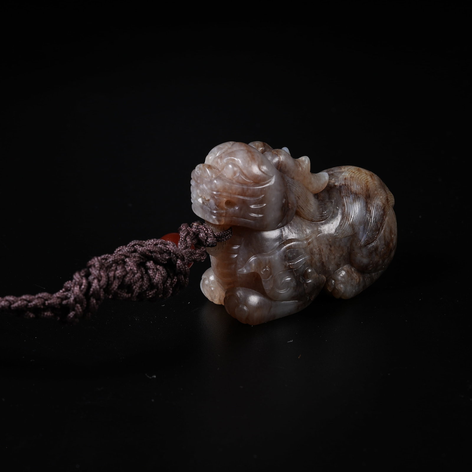 A MEDIEVAL JADE AUSPICIOUS BEAST PENDANT (1 of 8)