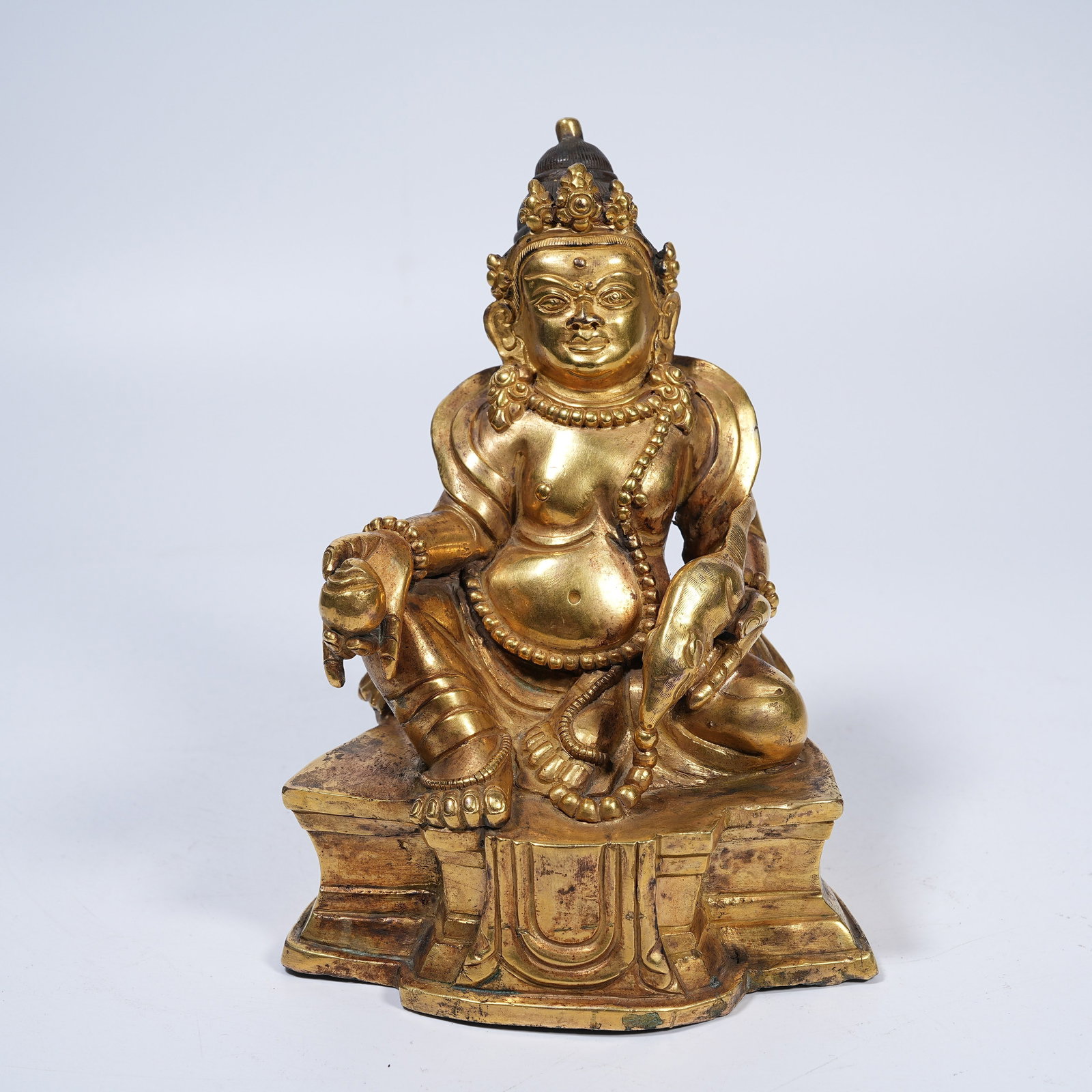 A GILT BRONZE YELLOW JAMBHALA STATUE: Gilt Bronze Yellow Jambhala Statue
