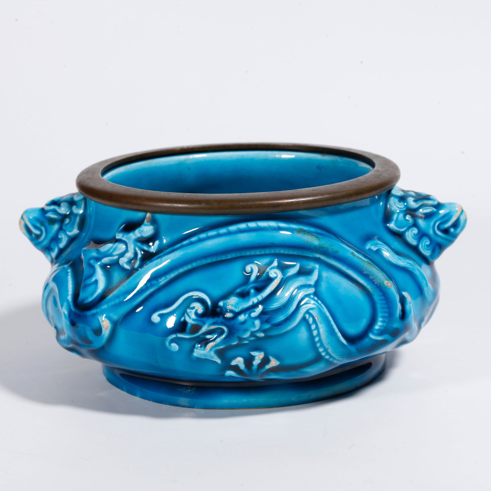 A PEACOCK BLUE GLAZE CENSER WITH RELIEF DRAGON PATTERNS AND DOUBLE BEAST EARS: Peacock Blue Glaze Censer with Relief Dragon Patterns and Double Beast Ears