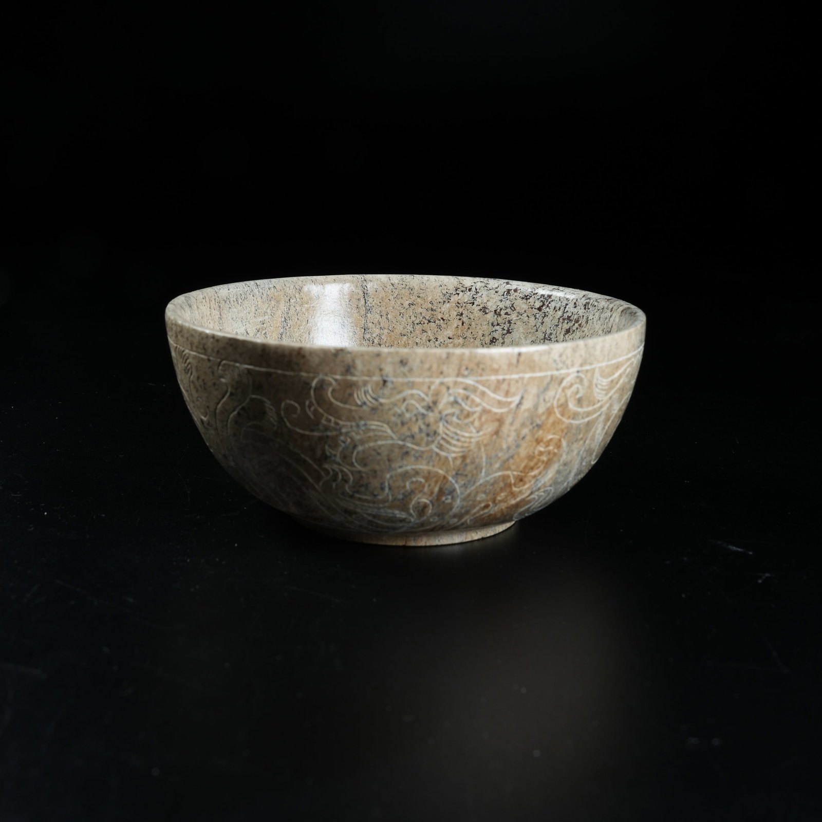 A ARCHAIC JADE BOWL WITH PHOENIX PATTERN: Archaic Jade Bowl with Phoenix Pattern