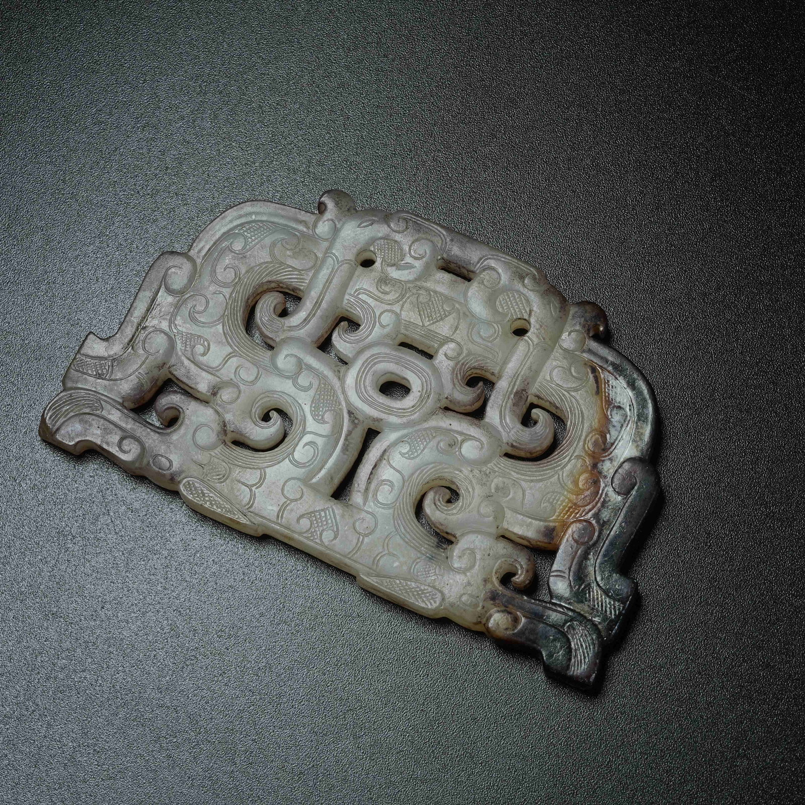 A ARCHAIC JADE S-SHAPED DRAGON PENDANT: Archaic Jade S-shaped Dragon Pendant