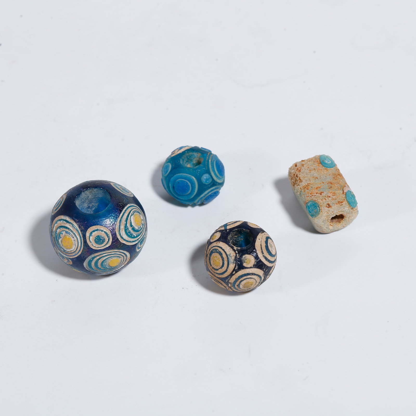 A GROUP OF GLASS BEADS: Group of Glass Beads