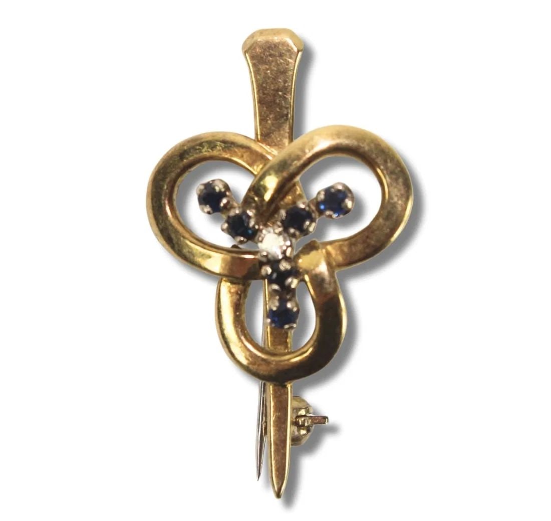 CLOVER-SHAPED BROOCH IN 18CT YELLOW GOLD WITH SAPPHIRES & A CENTRAL DIAMOND: Clover-shaped Brooch in 18ct Yellow Gold with Sapphires & a central Diamond