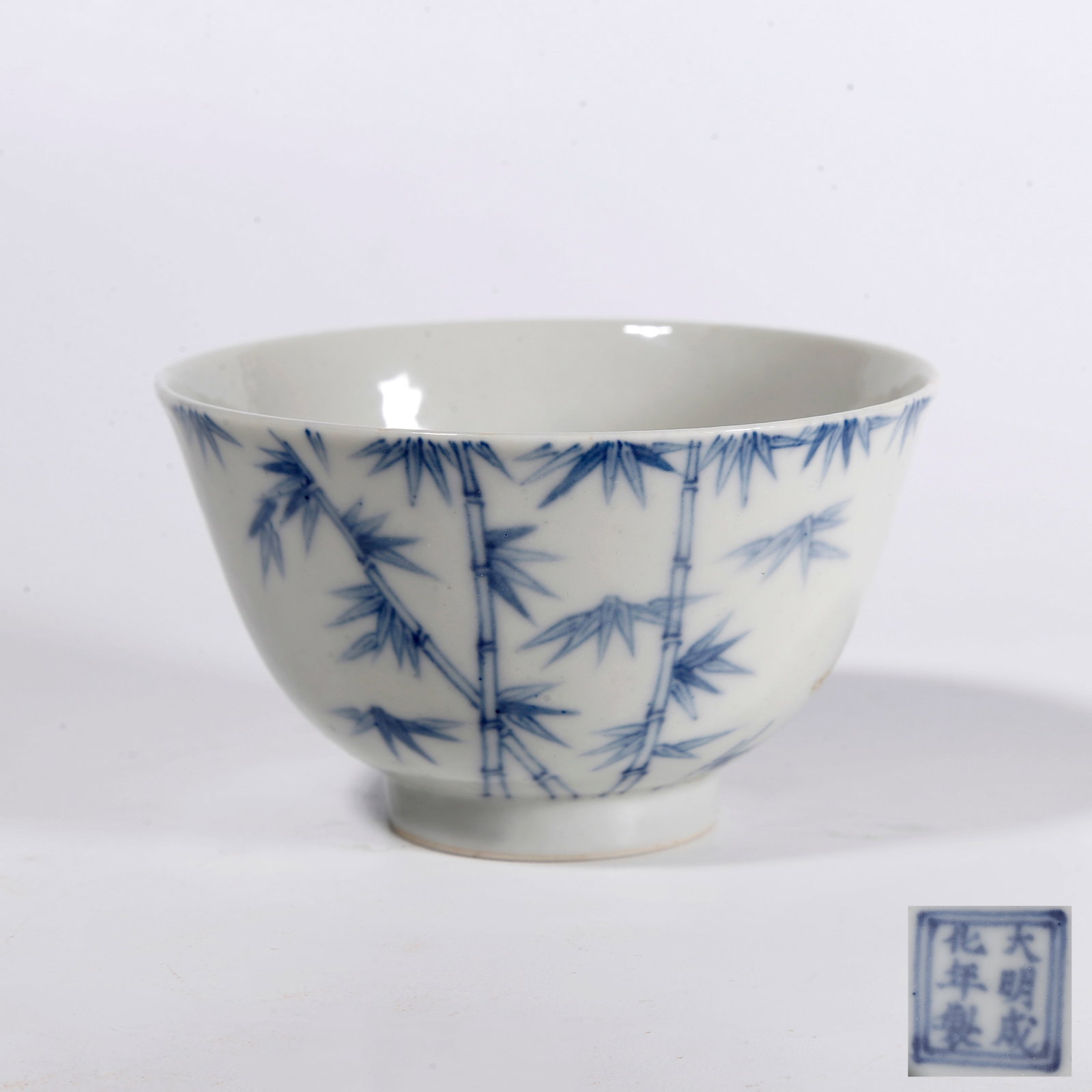 A BLUE AND WHITE CUP CARVED WITH BAMBOO PATTERNS: Blue and White Cup Carved with Bamboo Patterns