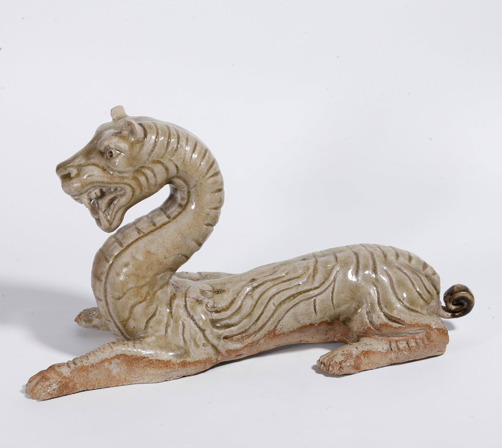 A YAOZHOU KILN BEAST-SHAPED ORNAMENT: Yaozhou Kiln Beast-Shaped Ornament