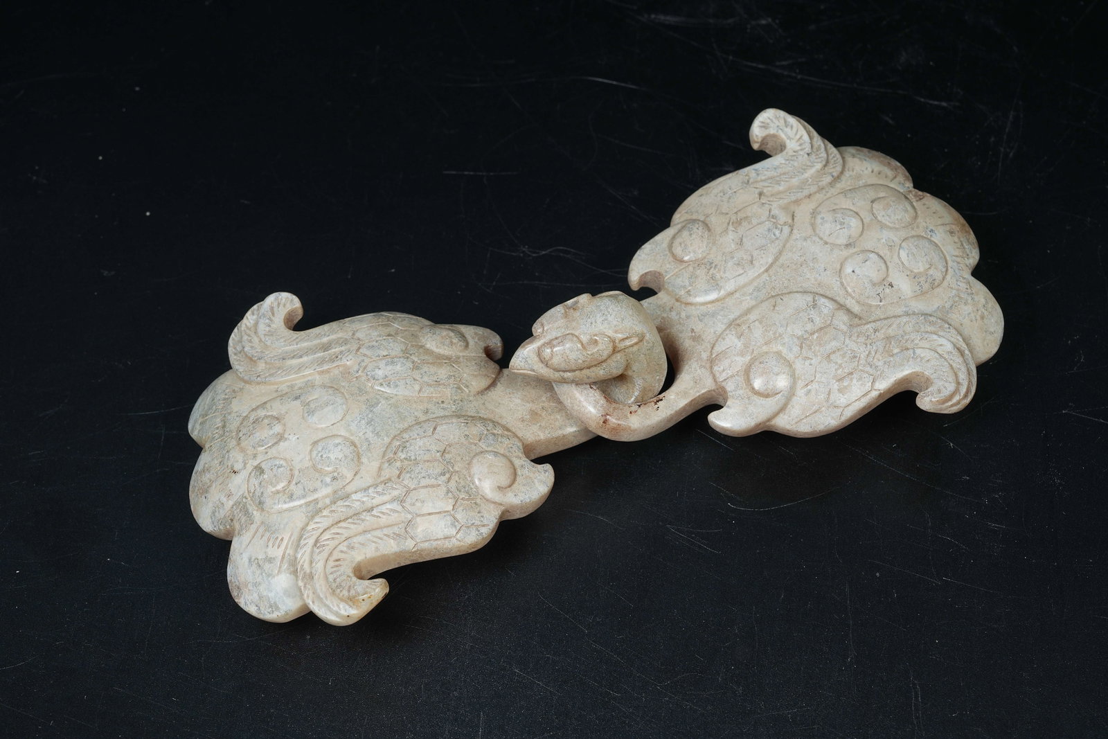 A ARCHAIC JADE BELT BUCKLE WITH PHOENIX HEAD: Archaic Jade Belt Buckle with Phoenix Head