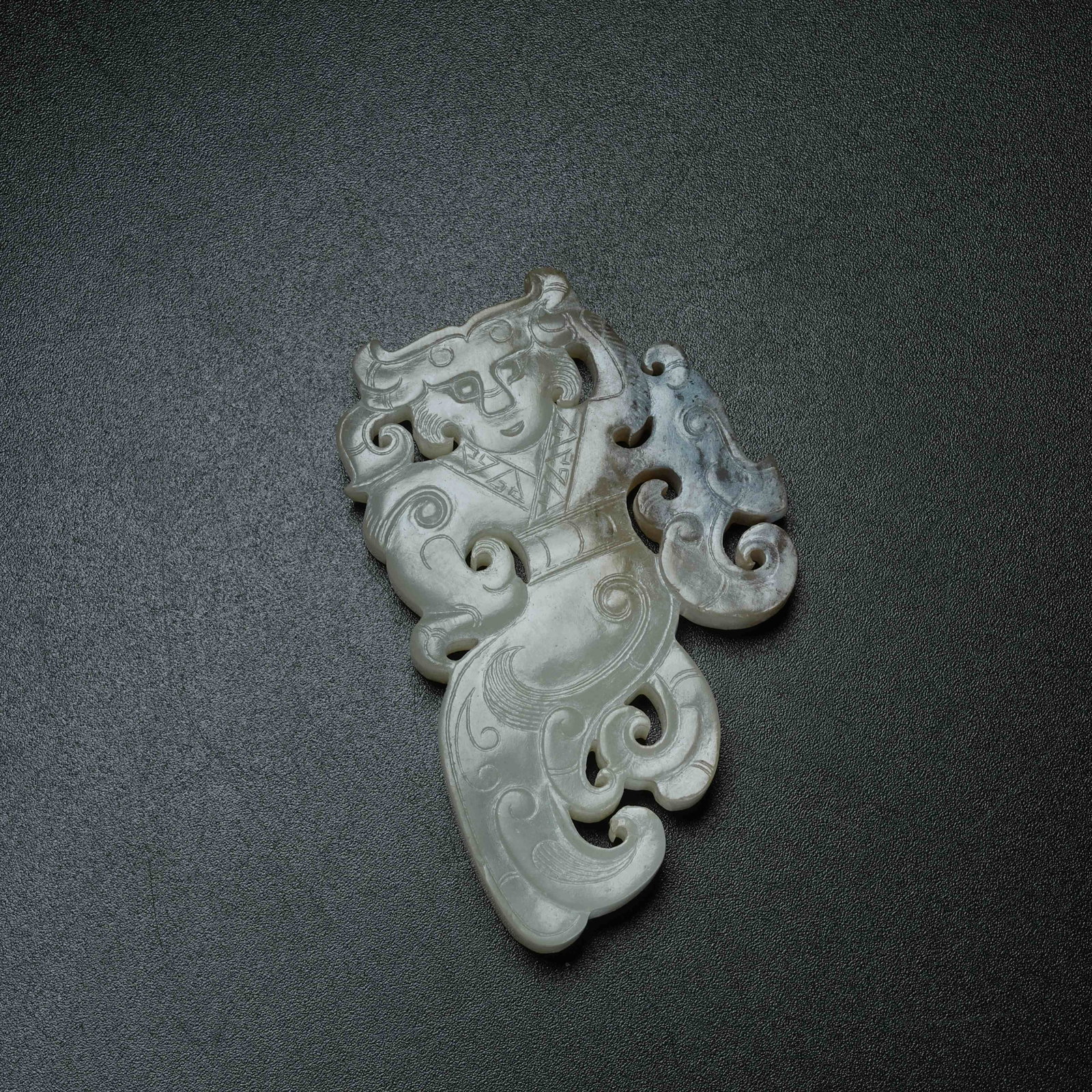 A ARCHAIC JADE DANCING FIGURE PENDANT (1 of 8)